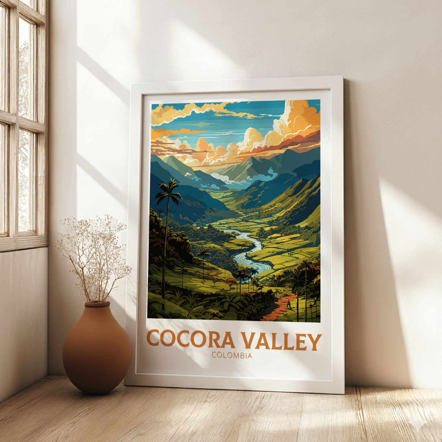 Framed artwork of Cocora Valley, Colombia, on a wall with a vase and plant.