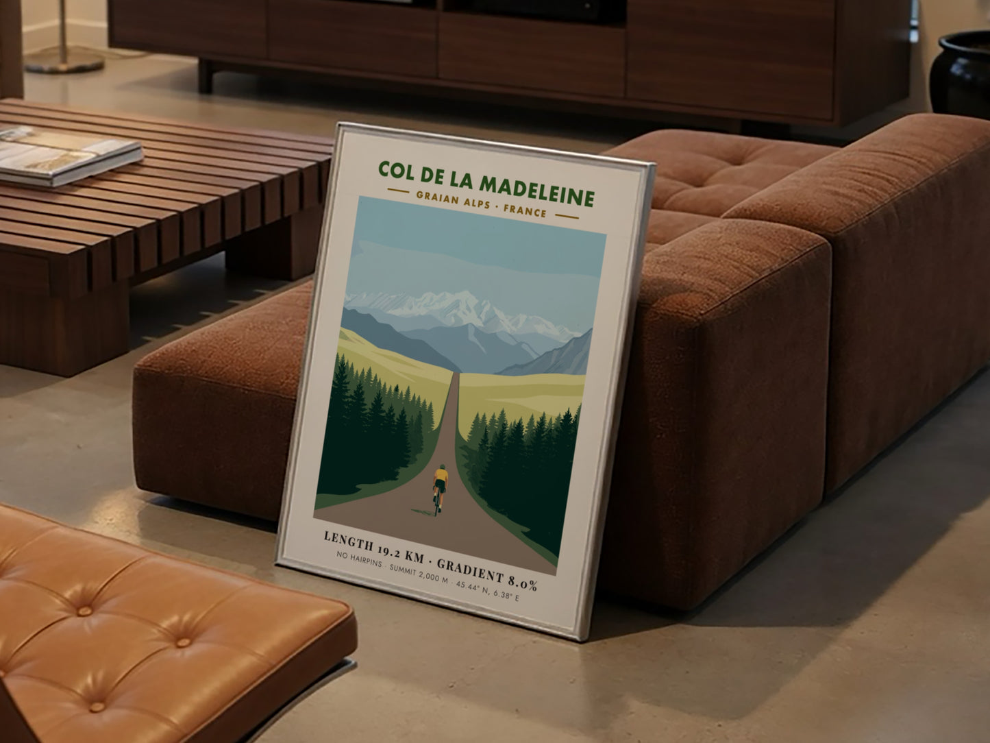 Poster of a cyclist climbing toward snow-capped mountains in the French Graian Alps landscape.