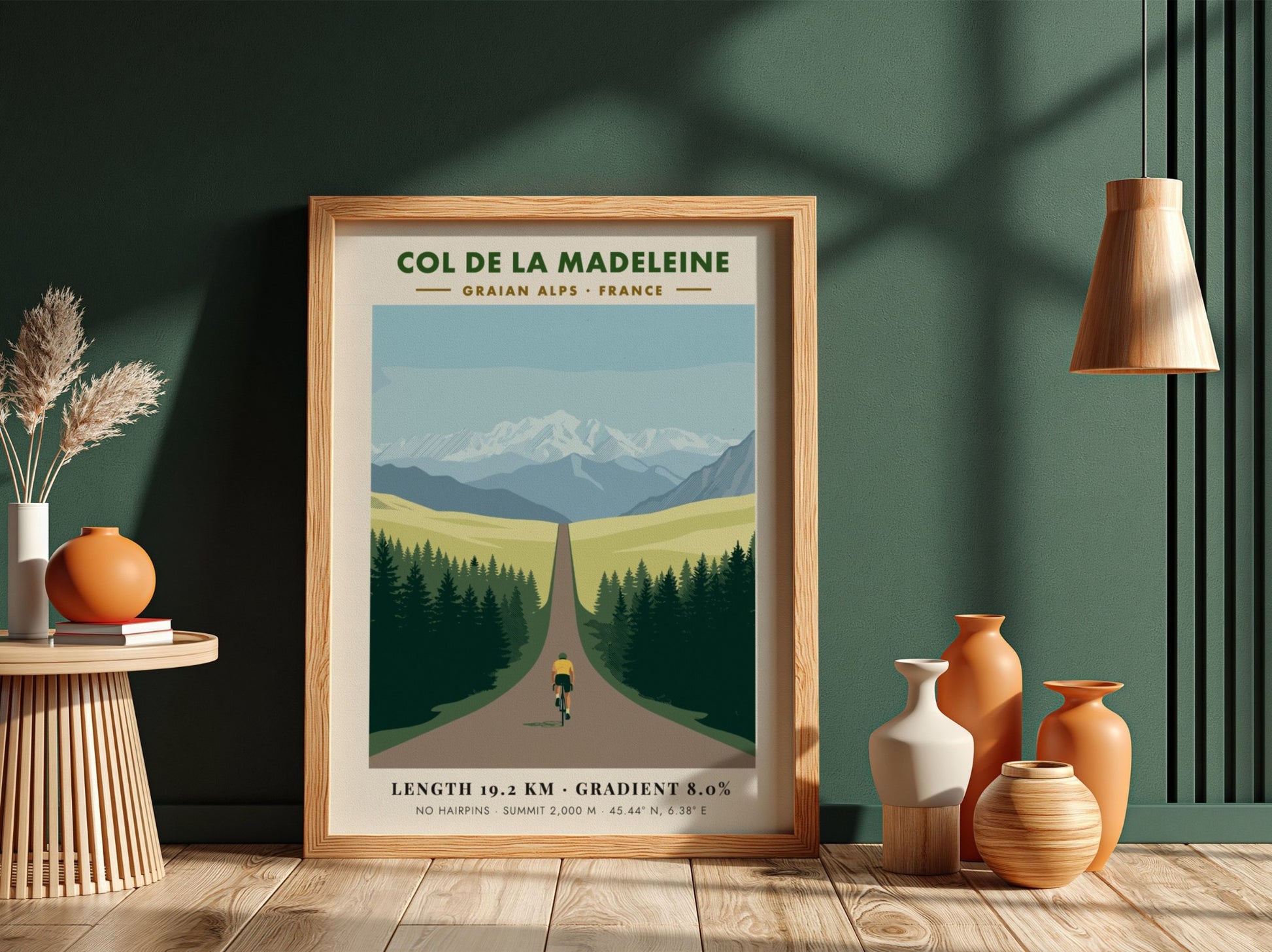 Poster of a cyclist climbing toward snow-capped mountains in the French Graian Alps landscape.