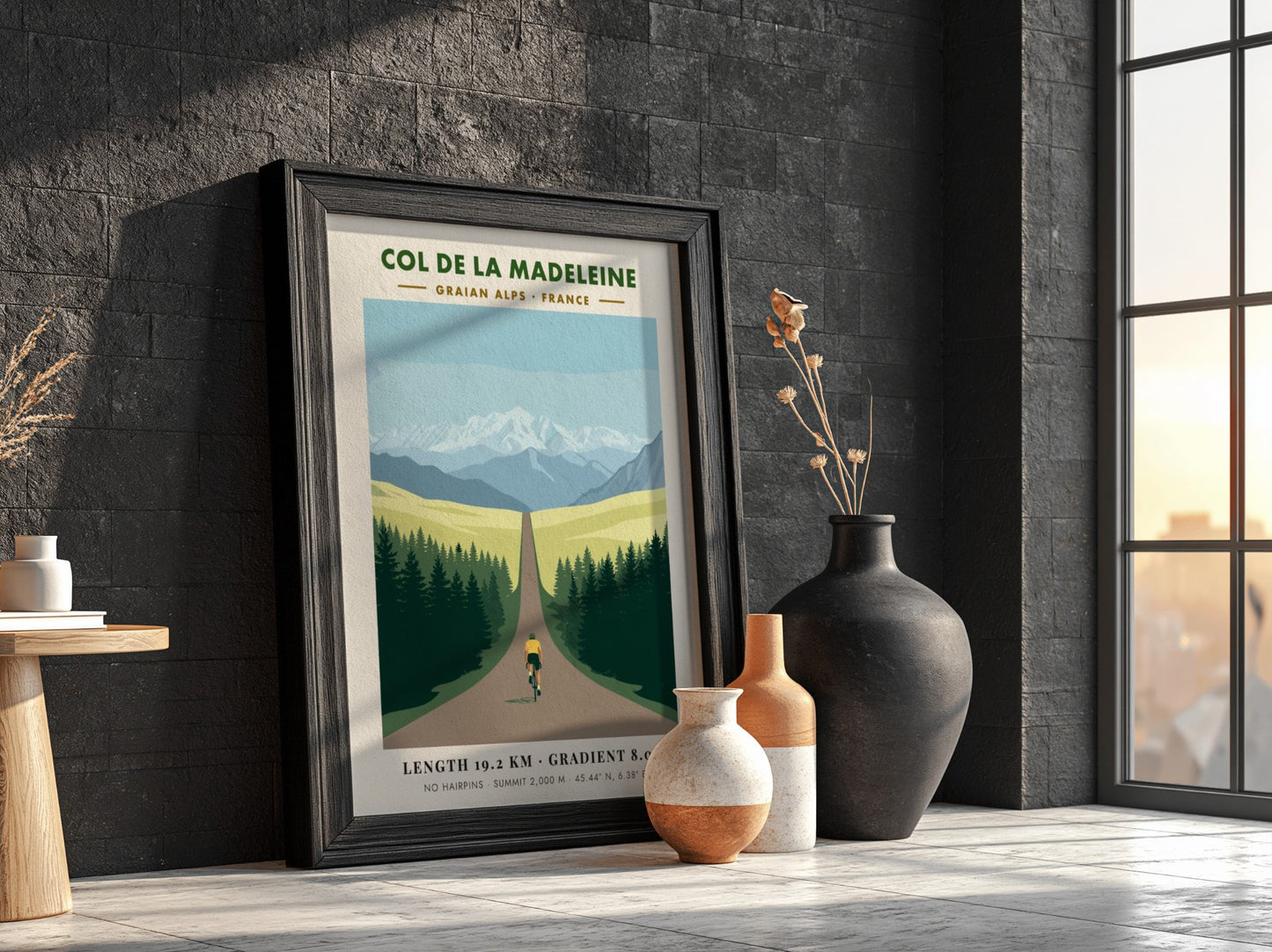 Poster of a cyclist climbing toward snow-capped mountains in the French Graian Alps landscape.