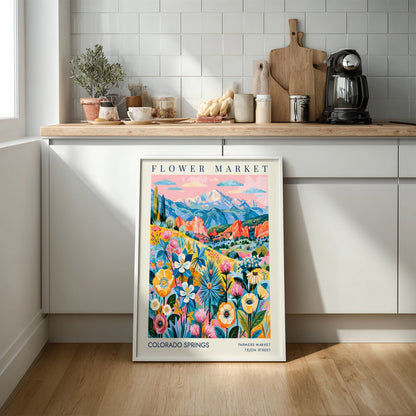 Colorado Springs flower market poster featuring vibrant flowers and mountains in a colorful design