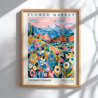 Colorado Springs flower market poster featuring vibrant flowers and mountains in a colorful design