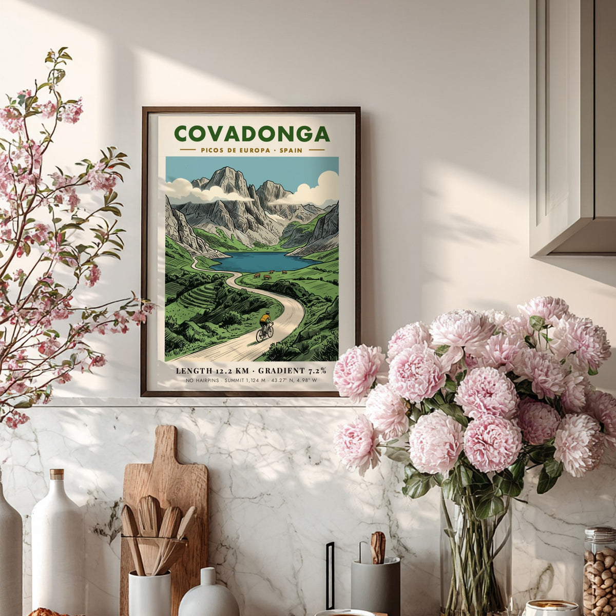 Poster of a cyclist riding through the scenic Covadonga Picos de Europa mountain range.