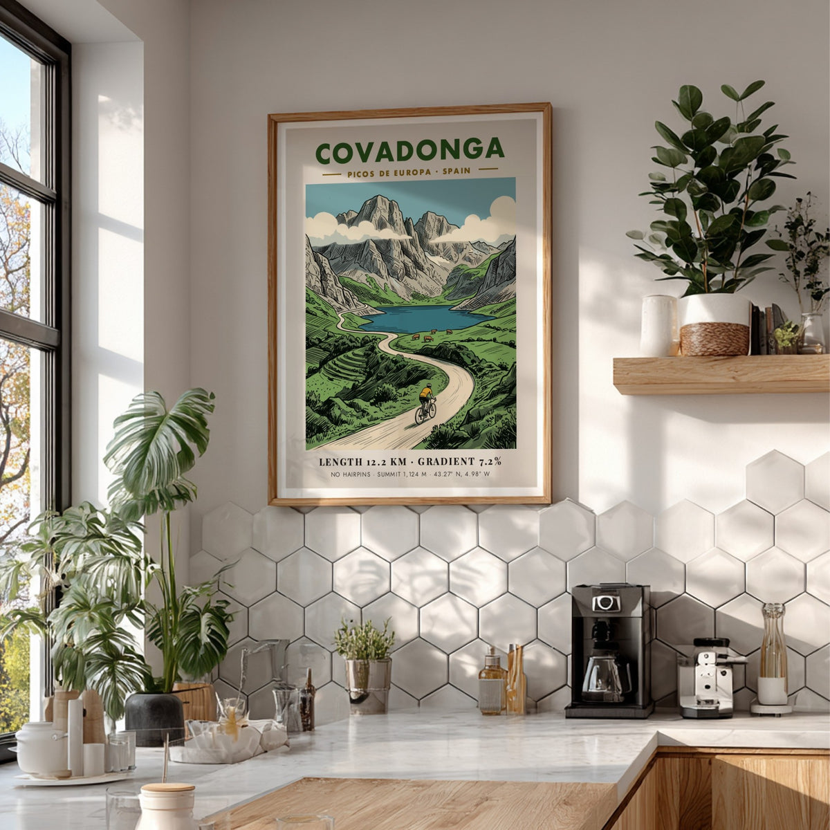 Poster of a cyclist riding through the scenic Covadonga Picos de Europa mountain range.