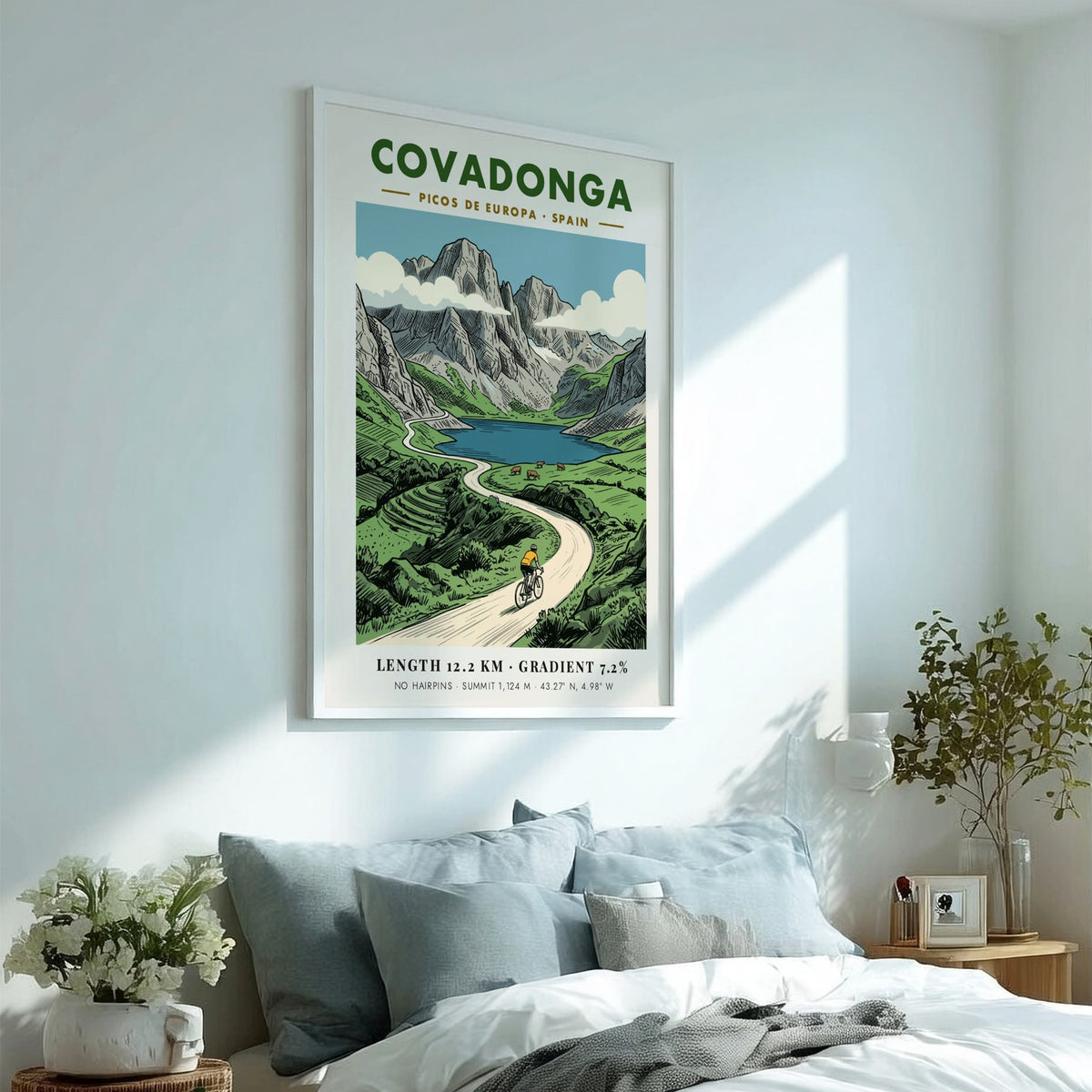 Poster of a cyclist riding through the scenic Covadonga Picos de Europa mountain range.