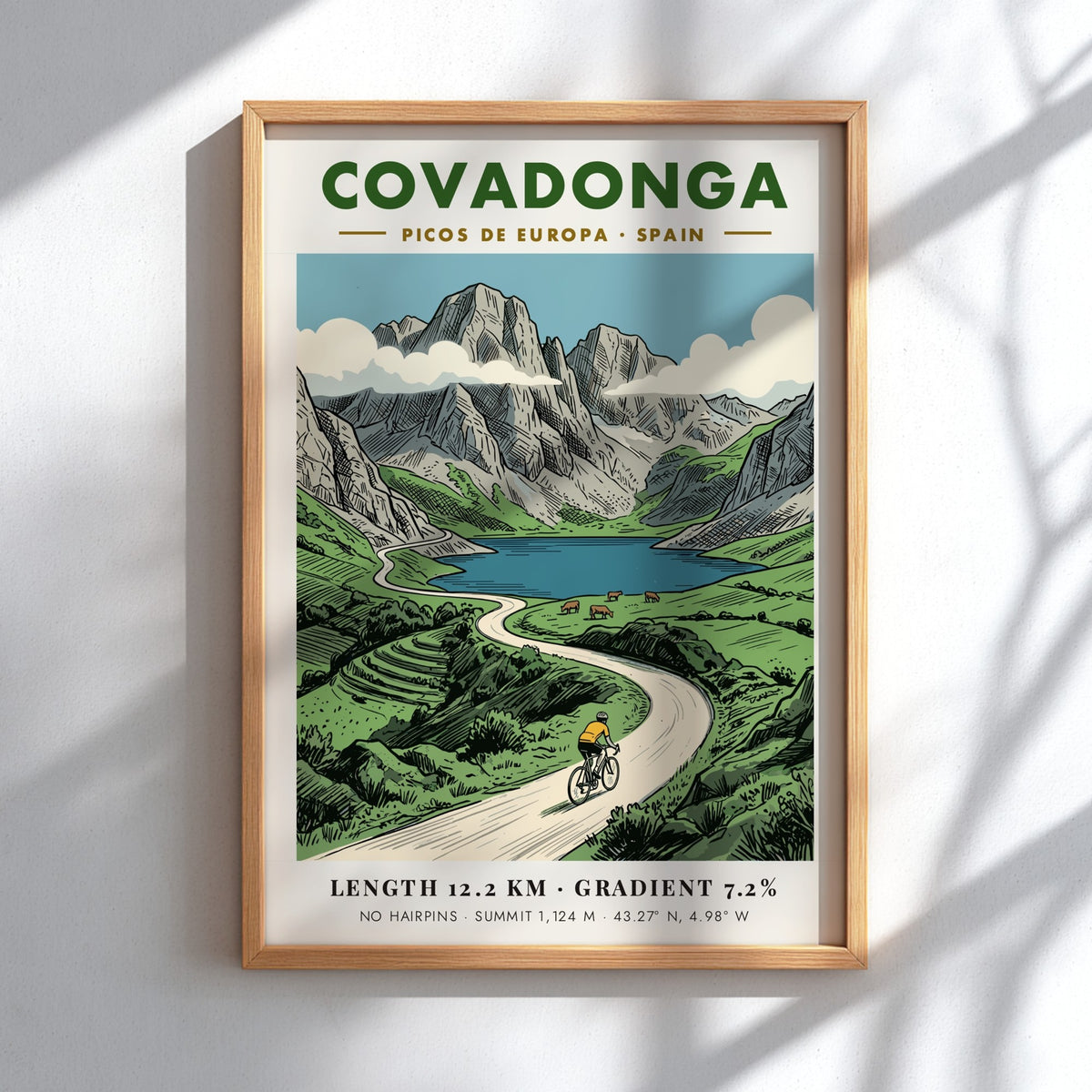Poster of a cyclist riding through the scenic Covadonga Picos de Europa mountain range.