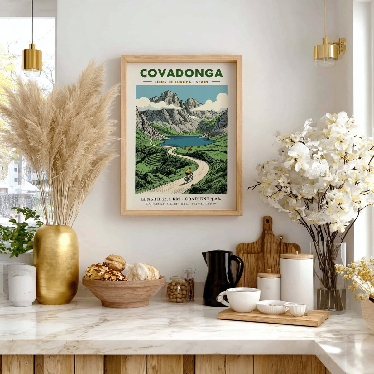 Poster of a cyclist riding through the scenic Covadonga Picos de Europa mountain range.