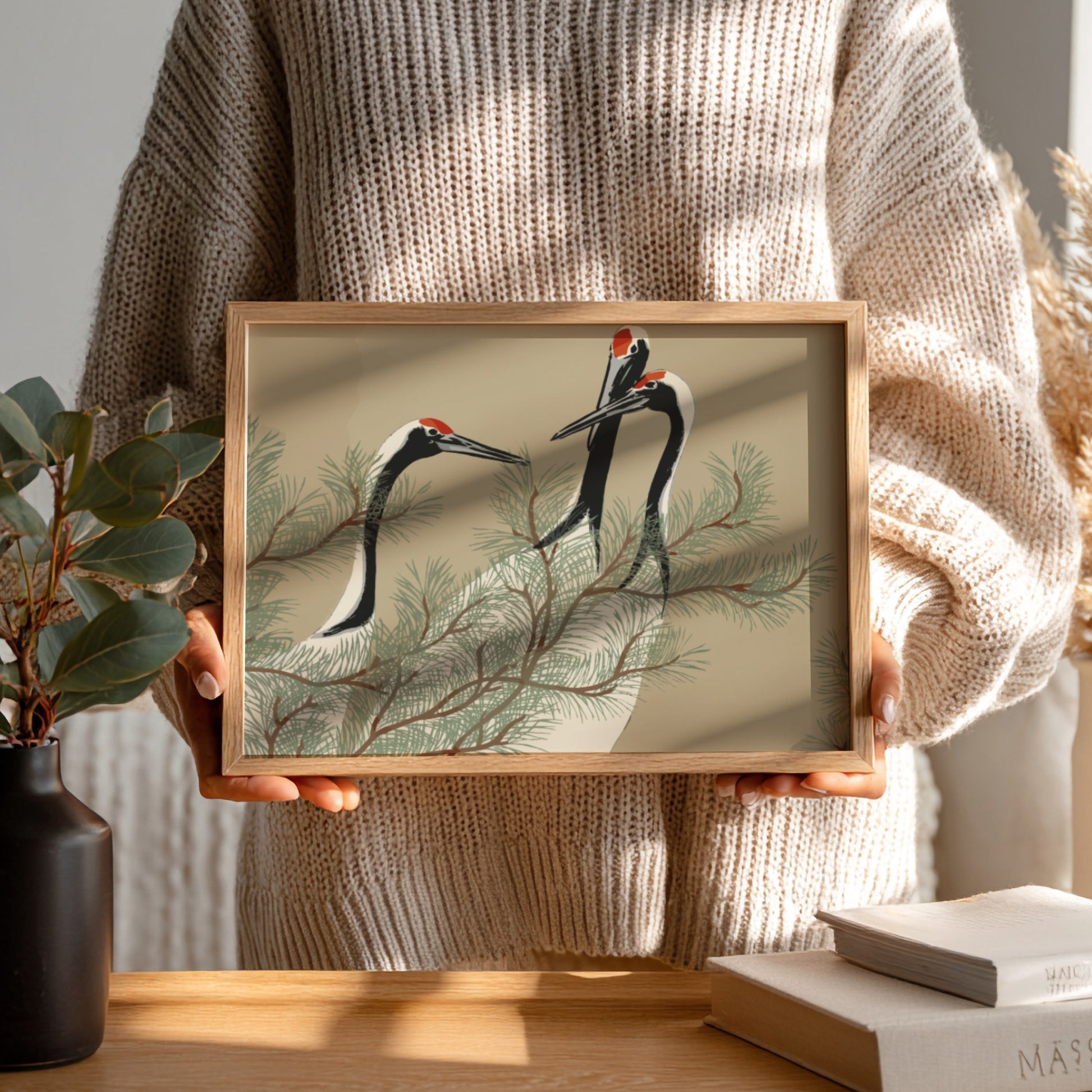 A framed drawing titled 'Cranes (1909)' by Kamisaka Sekka, featuring three cranes amidst pine branches in a