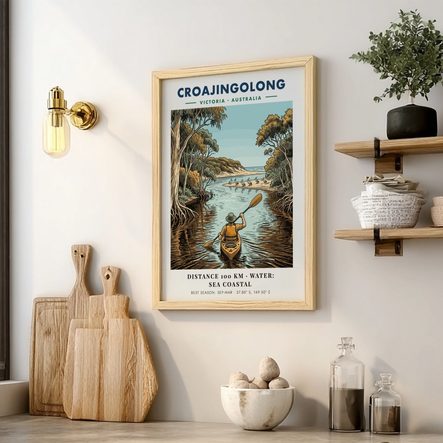 Poster featuring a person kayaking through Croajingolong, Victoria, with pelicans on a beach.