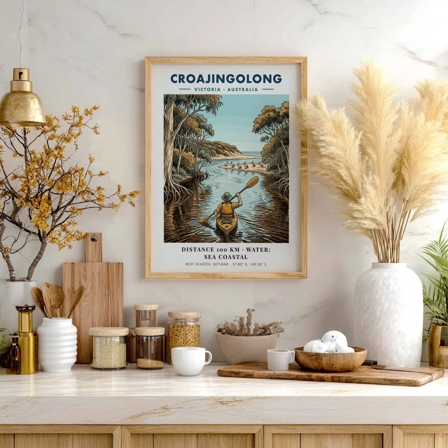 Poster featuring a person kayaking through Croajingolong, Victoria, with pelicans on a beach.