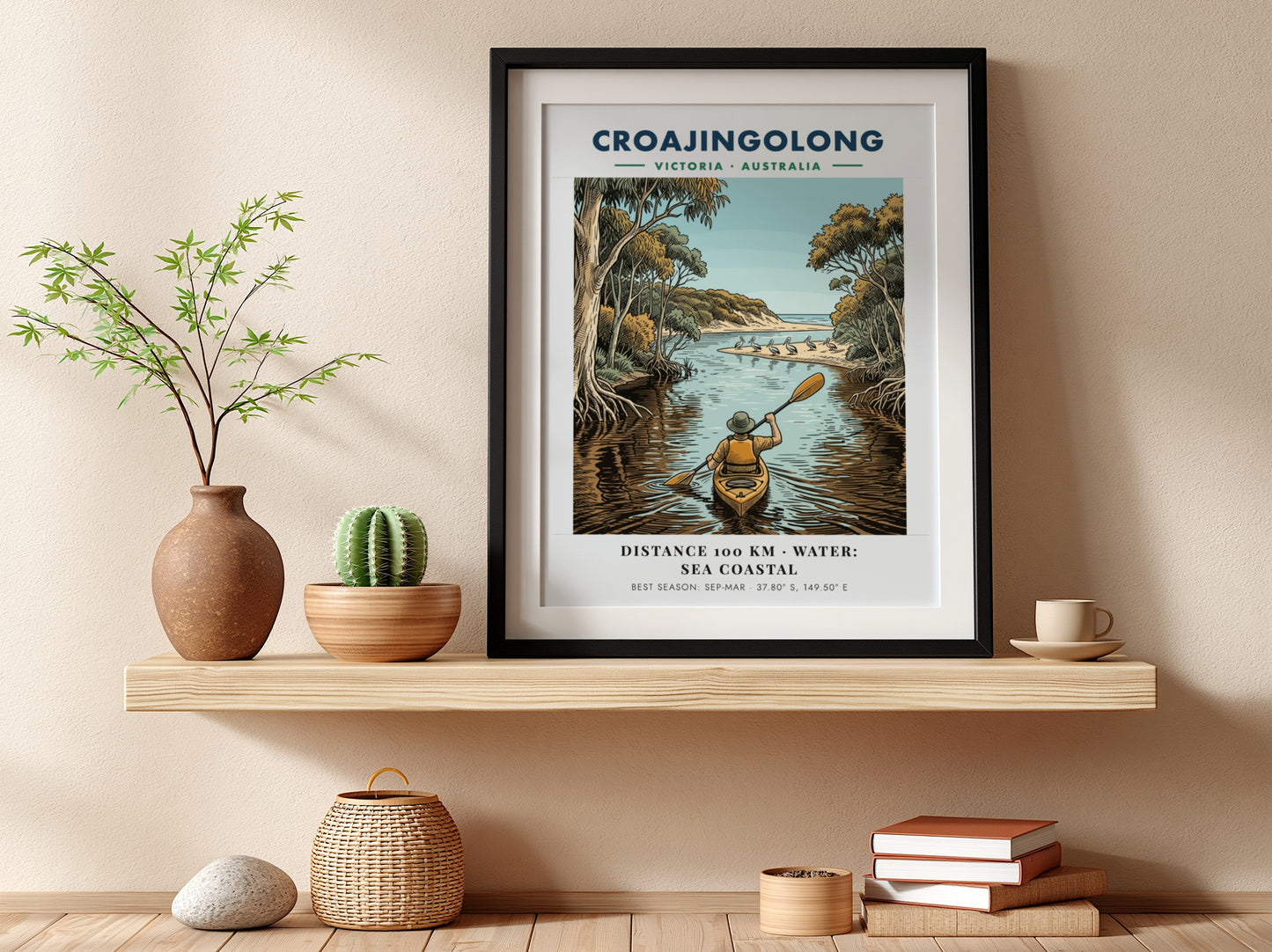 Poster featuring a person kayaking through Croajingolong, Victoria, with pelicans on a beach.