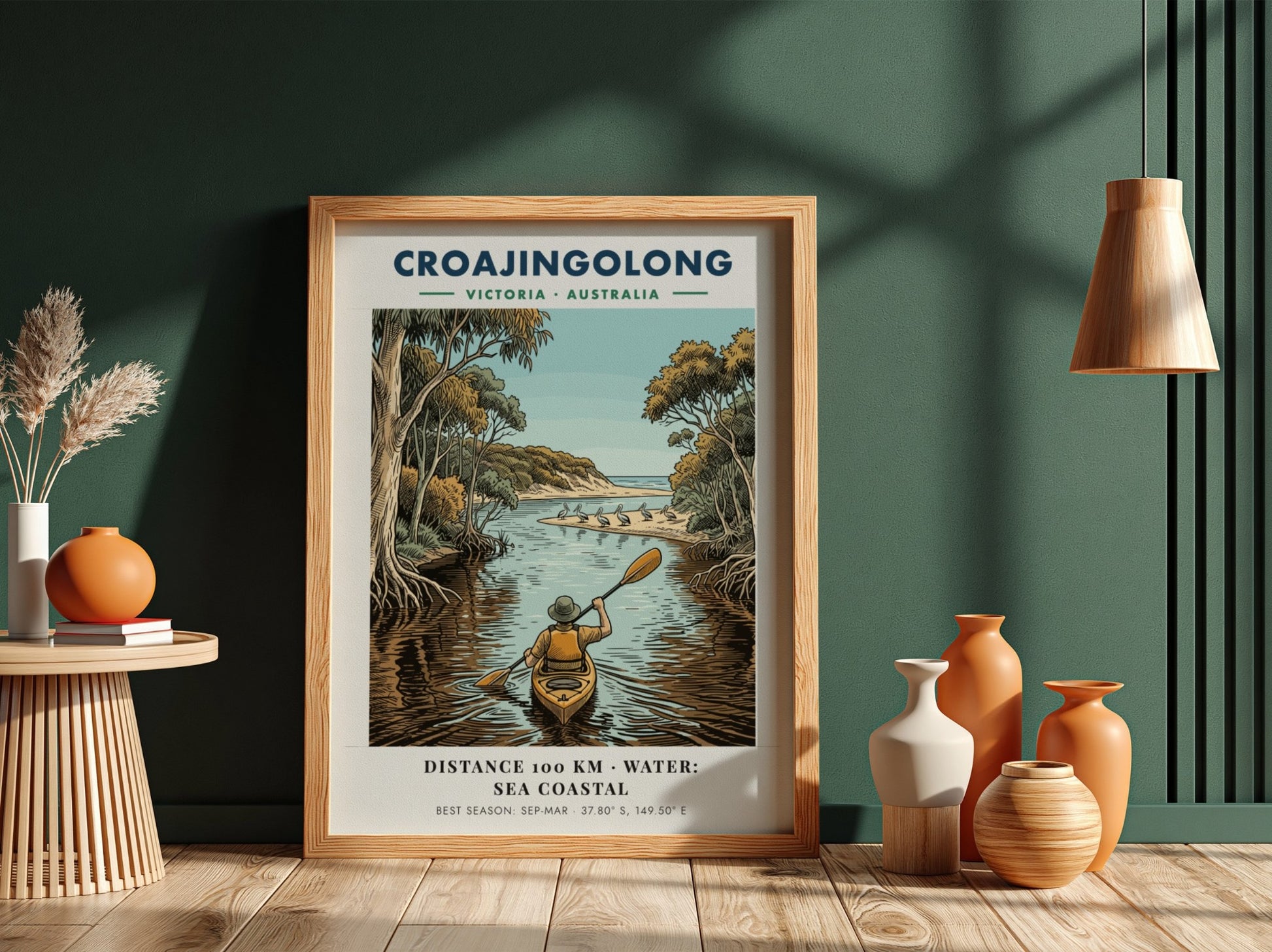Poster featuring a person kayaking through Croajingolong, Victoria, with pelicans on a beach.