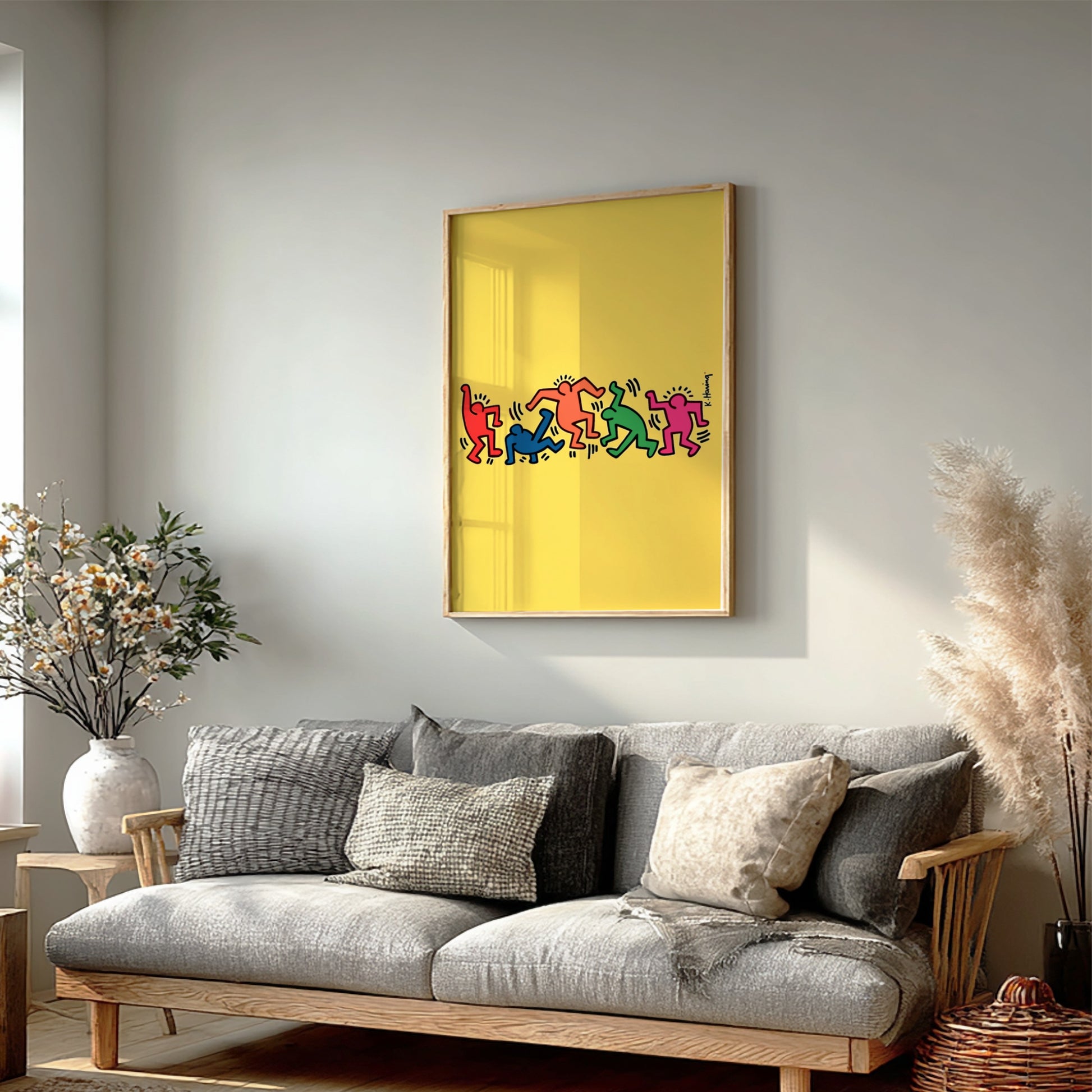 Keith Haring "Dancing Figures" poster with colorful figures on a yellow background.