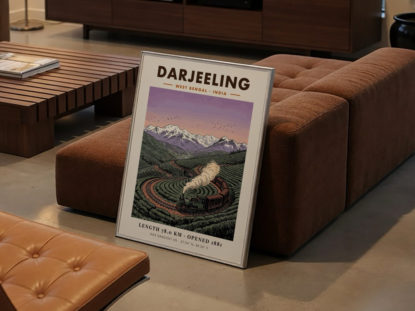 Poster showing a vintage steam train winding through green tea fields in Darjeeling India