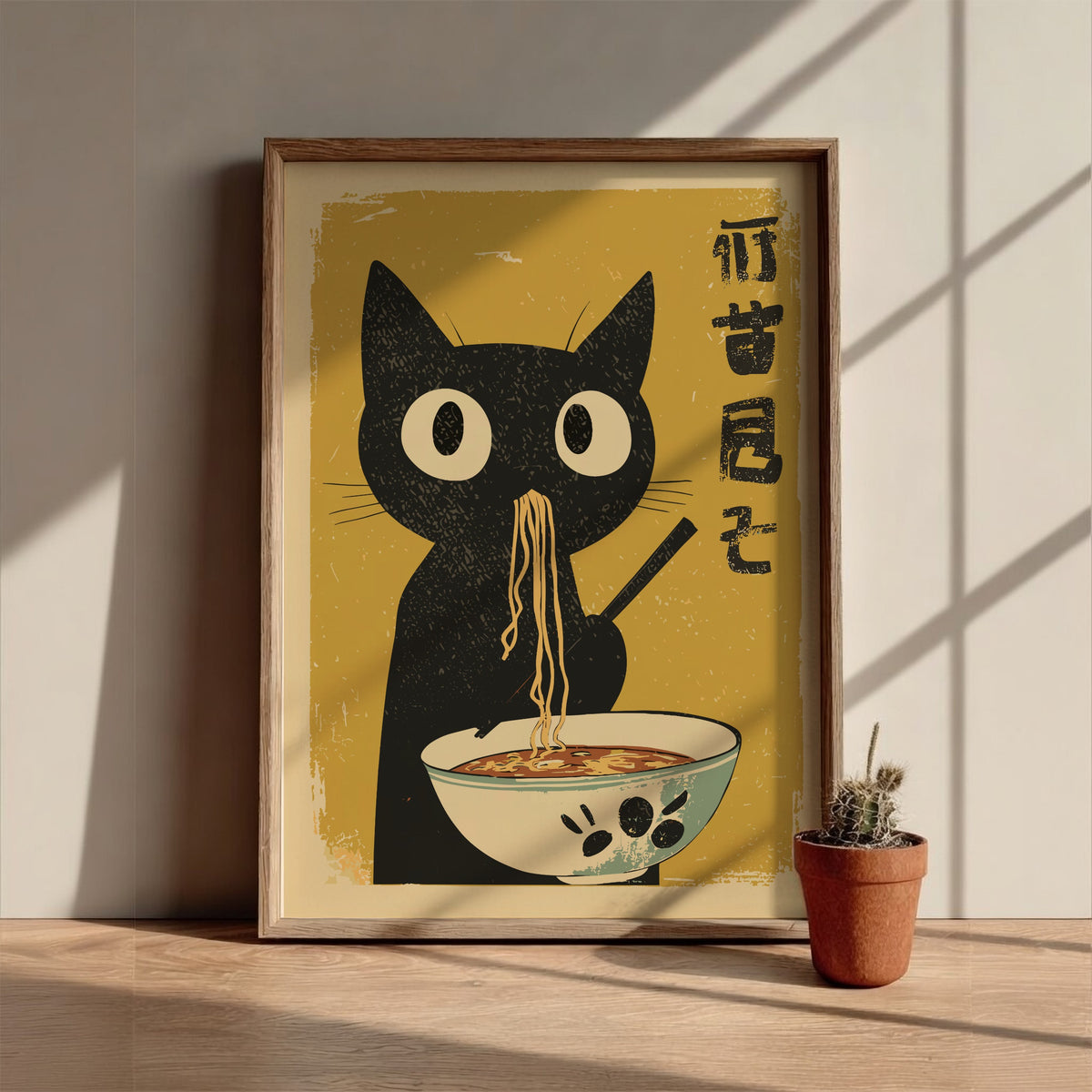 A stylized poster-style illustration of a black cat holding chopsticks and eating noodles from a bowl, set against a warm yellow background with black Japanese characters on the right.