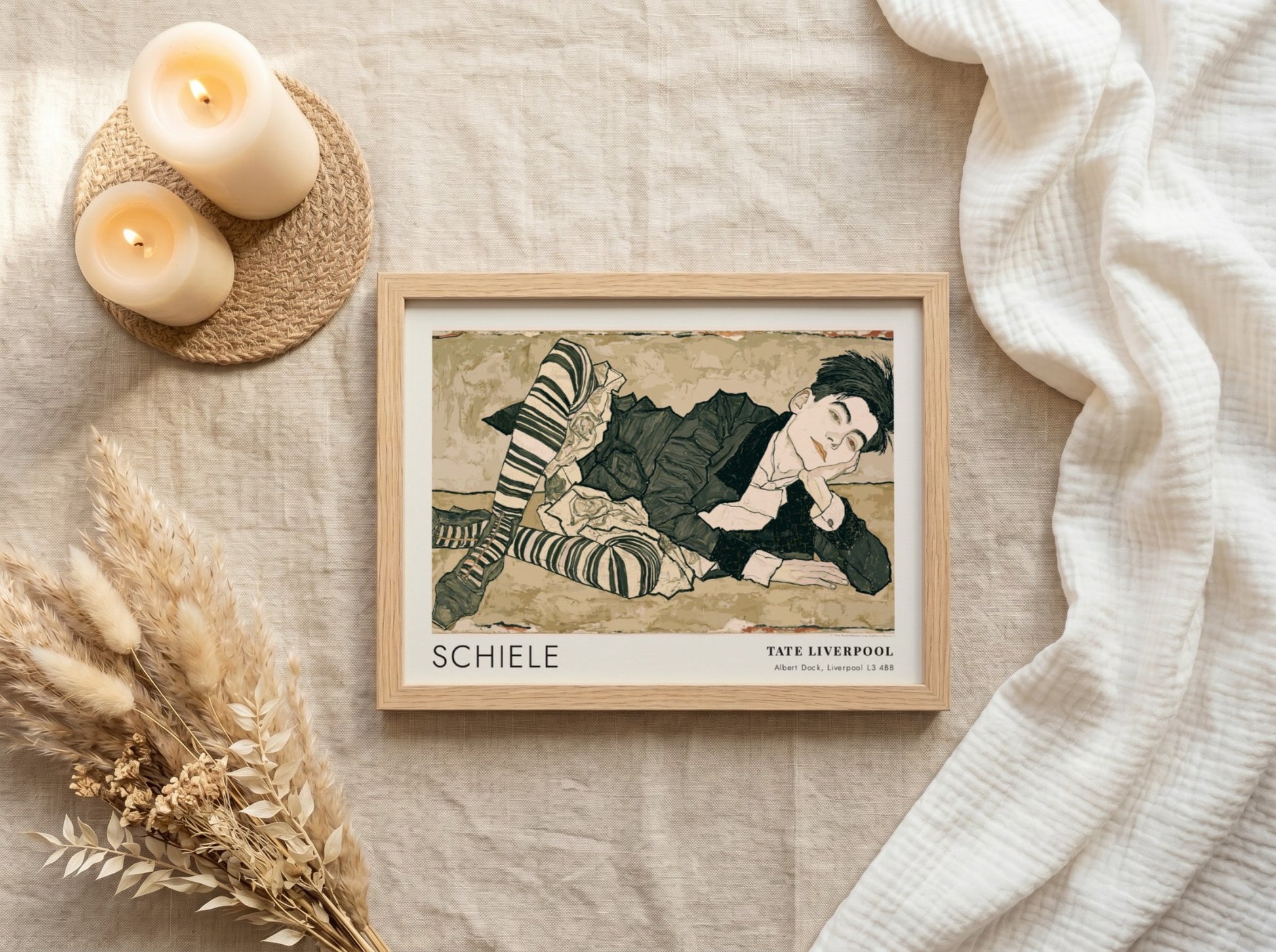 Wall art poster featuring an Egon Schiele portrait with striped stockings and text.