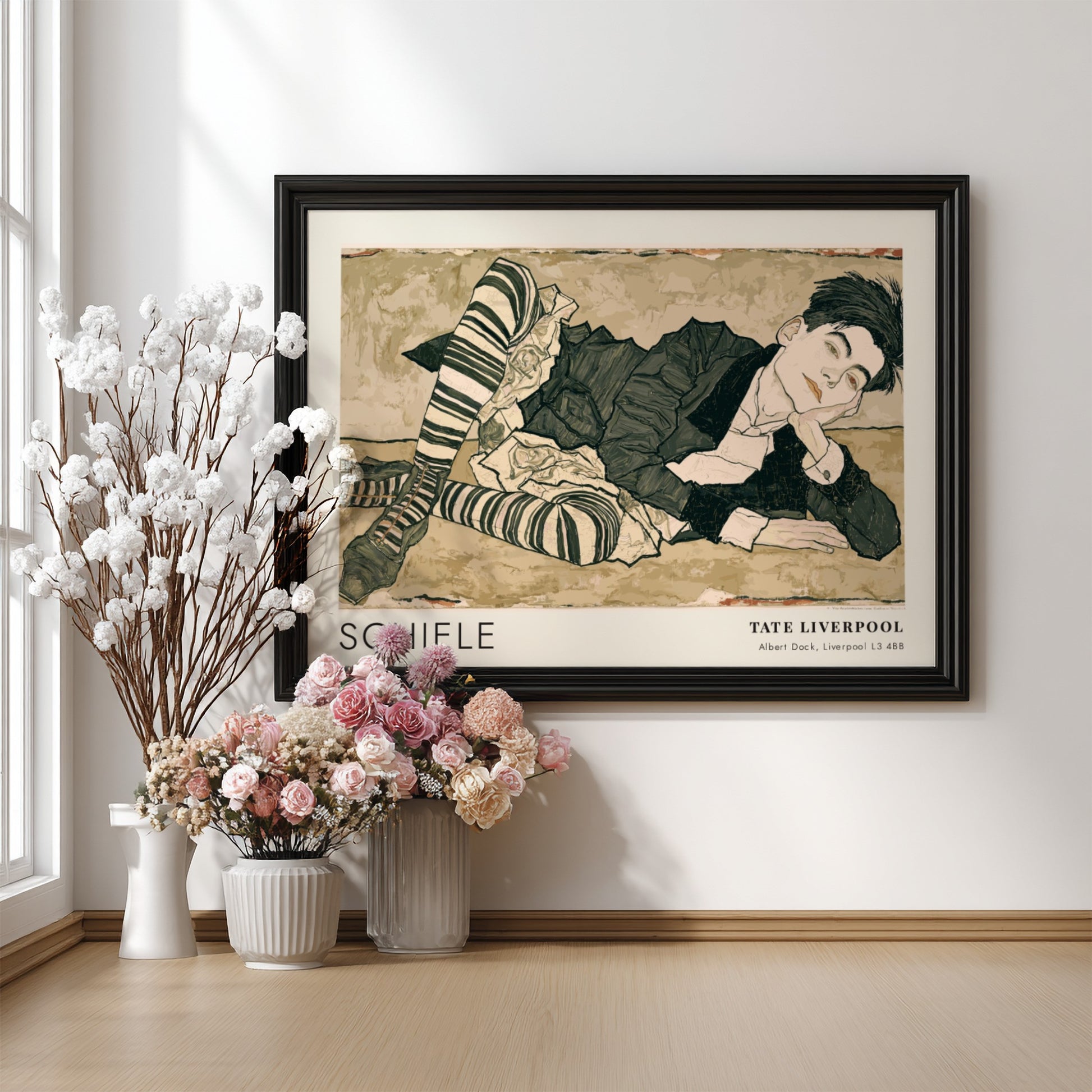 Wall art poster featuring an Egon Schiele portrait with striped stockings and text.