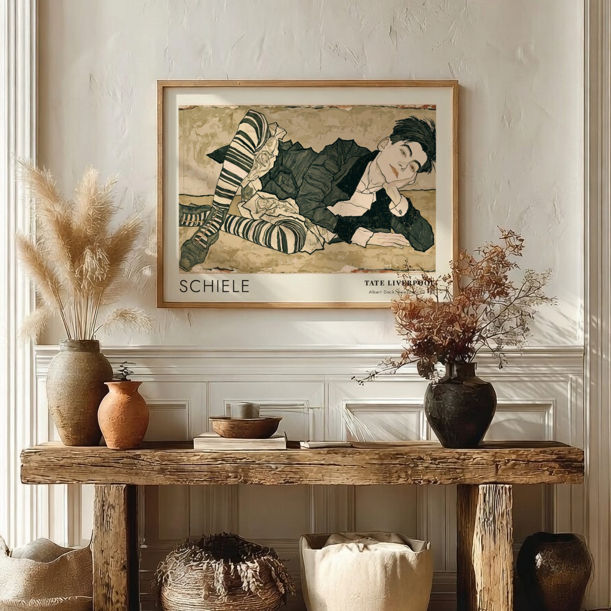 Wall art poster featuring an Egon Schiele portrait with striped stockings and text.