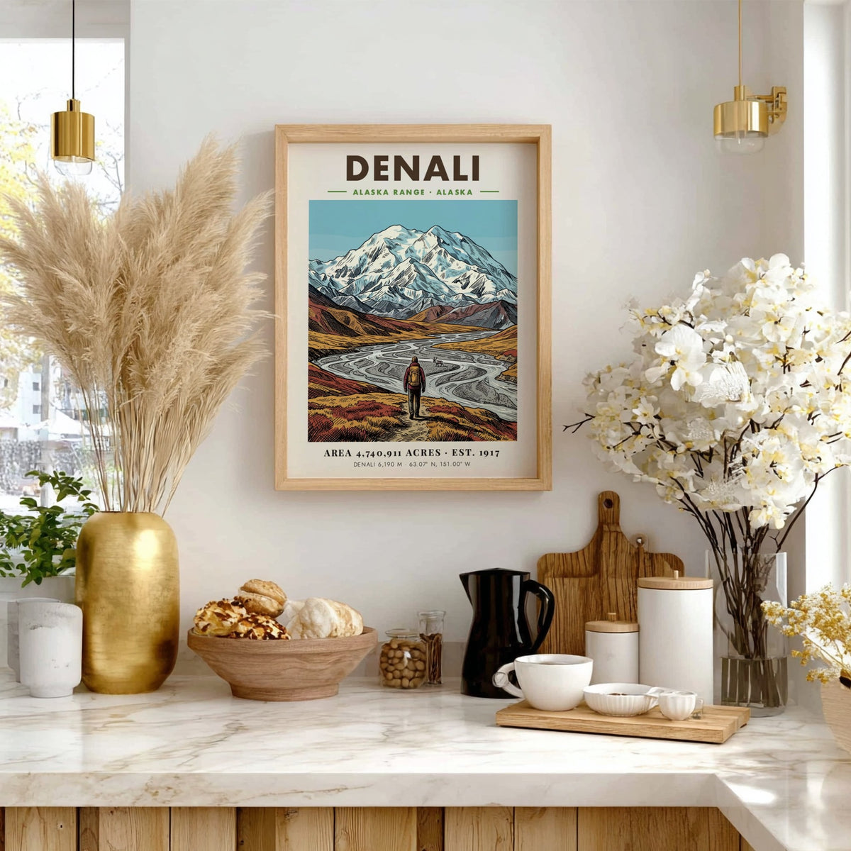 Poster of Denali mountains and a lone hiker in an Alaskan valley landscape.