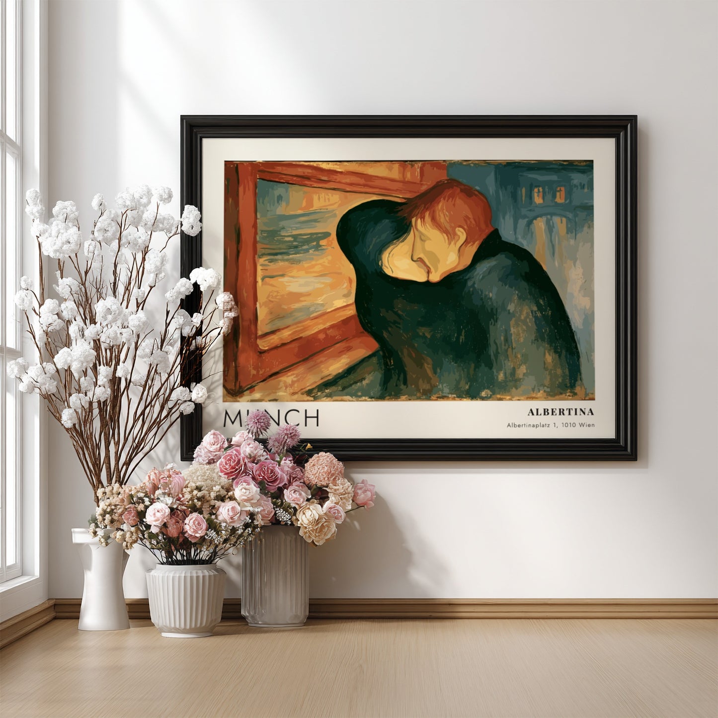 Exhibition poster featuring Edvard Munch's The Kiss in a wooden frame on wall
