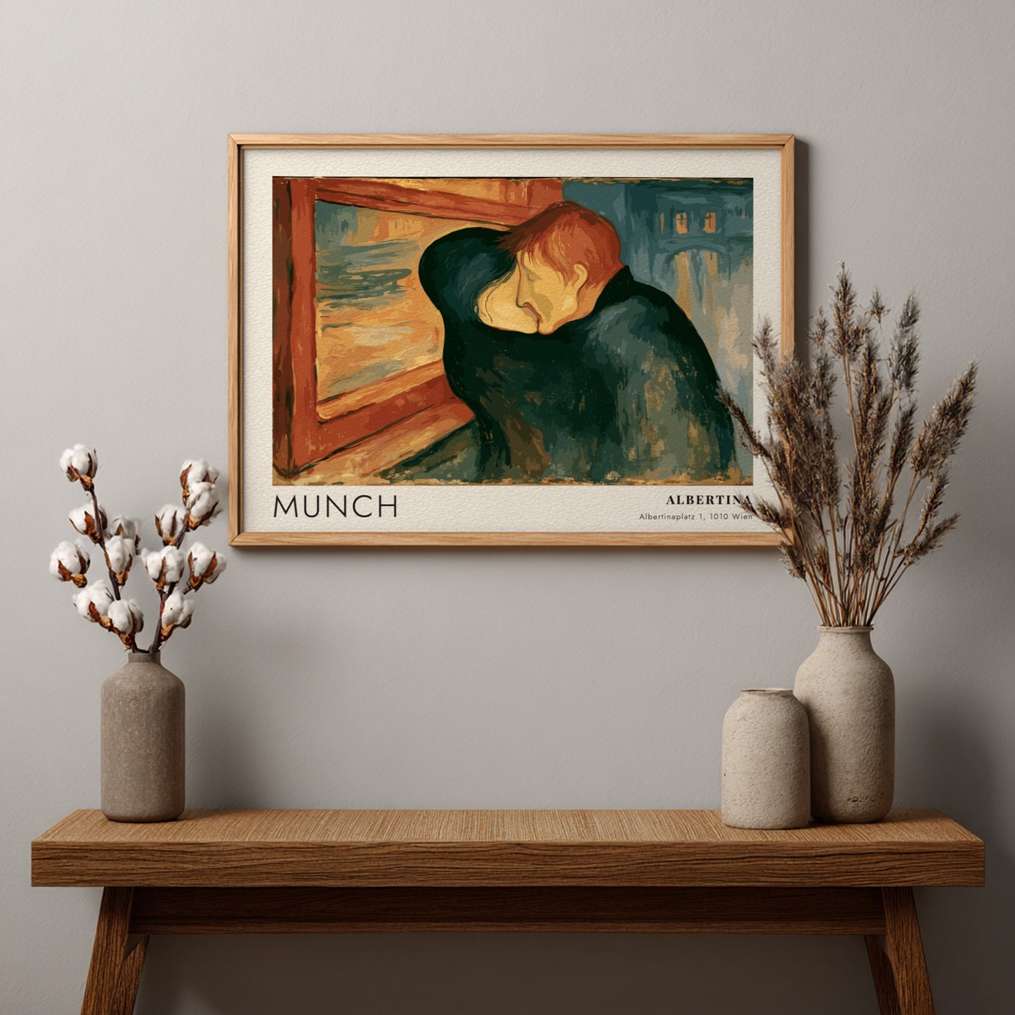 Exhibition poster featuring Edvard Munch's The Kiss in a wooden frame on wall