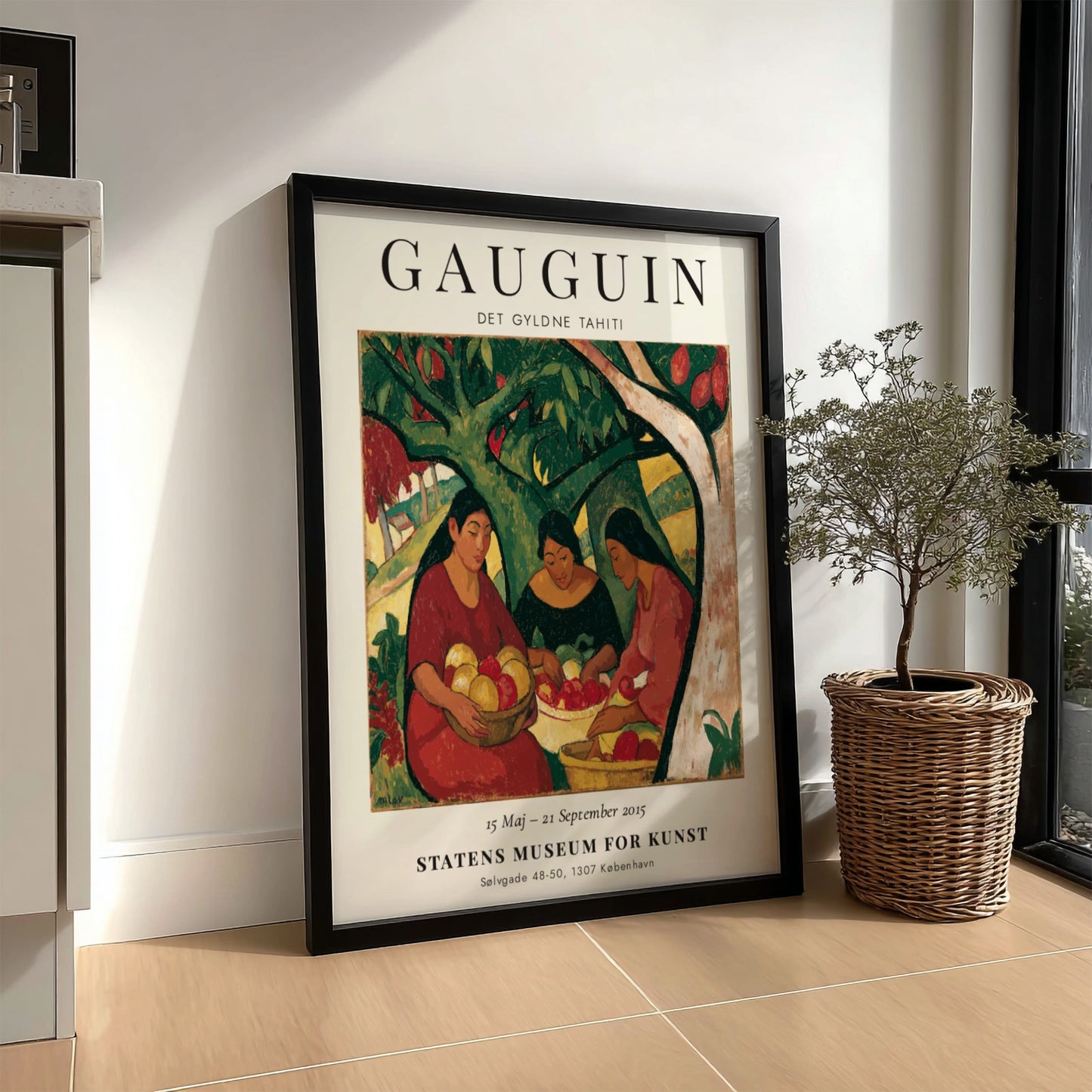 Gauguin exhibition poster featuring women in a vibrant Tahitian scene with rich colors and expressive
