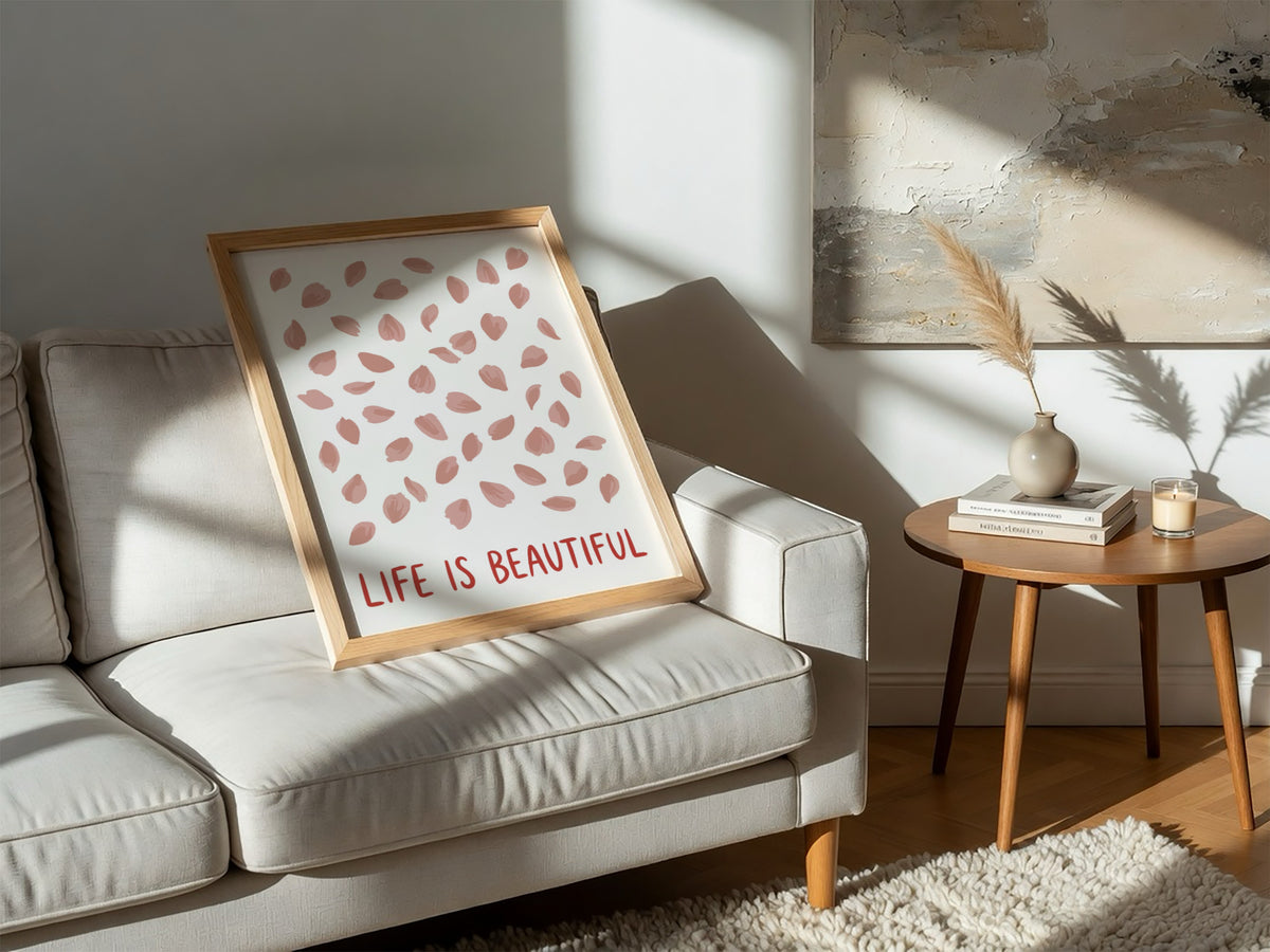 Motivational poster with pink cherry blossom petals and the text Life Is Beautiful.