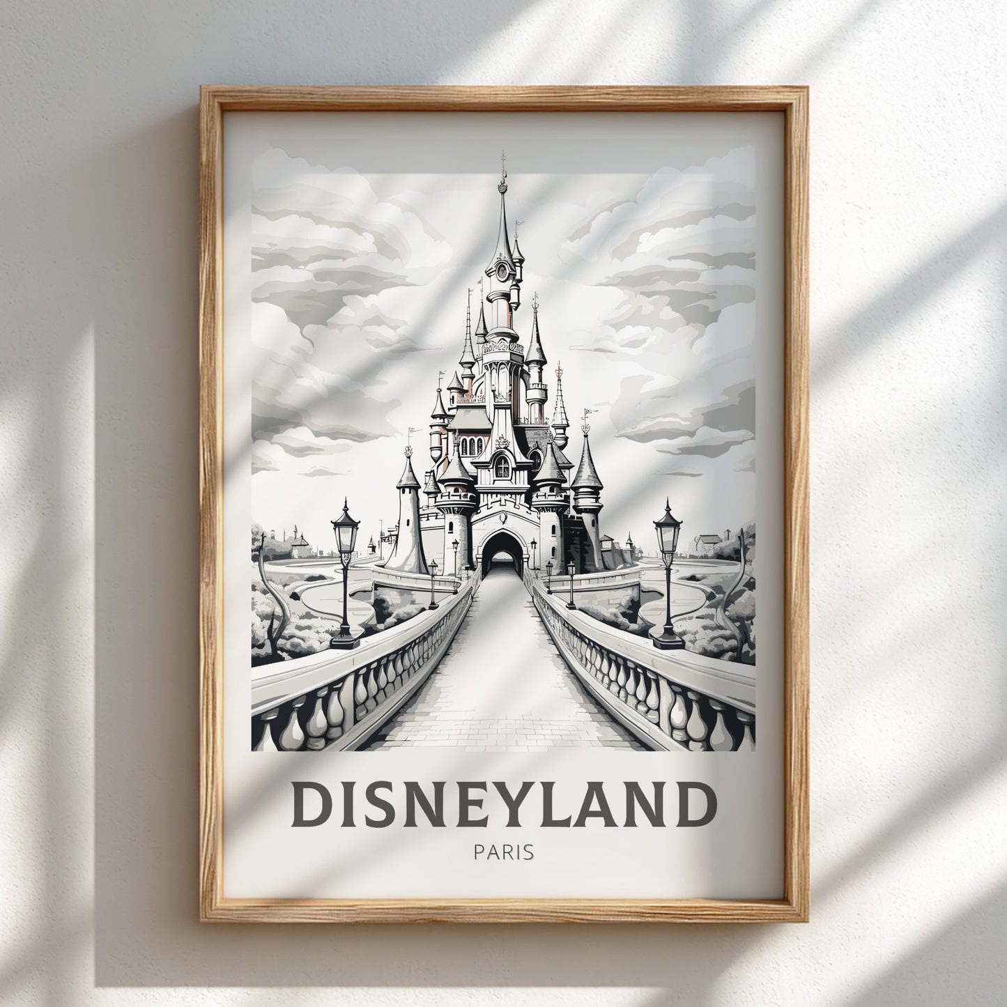 Framed artwork of Disneyland Paris castle on a white wall