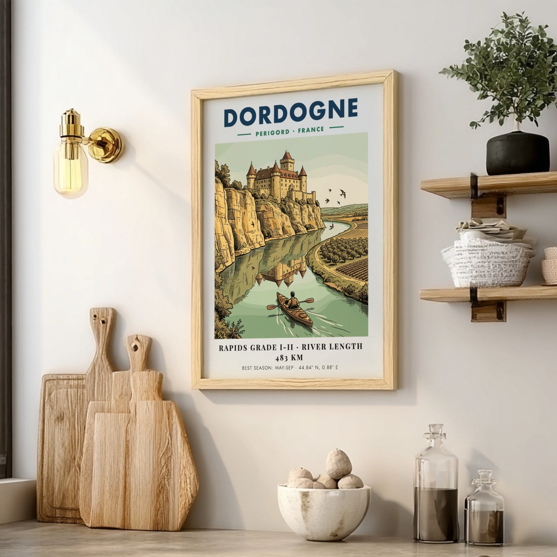 Poster featuring a castle overlooking the Dordogne River with a person kayaking below