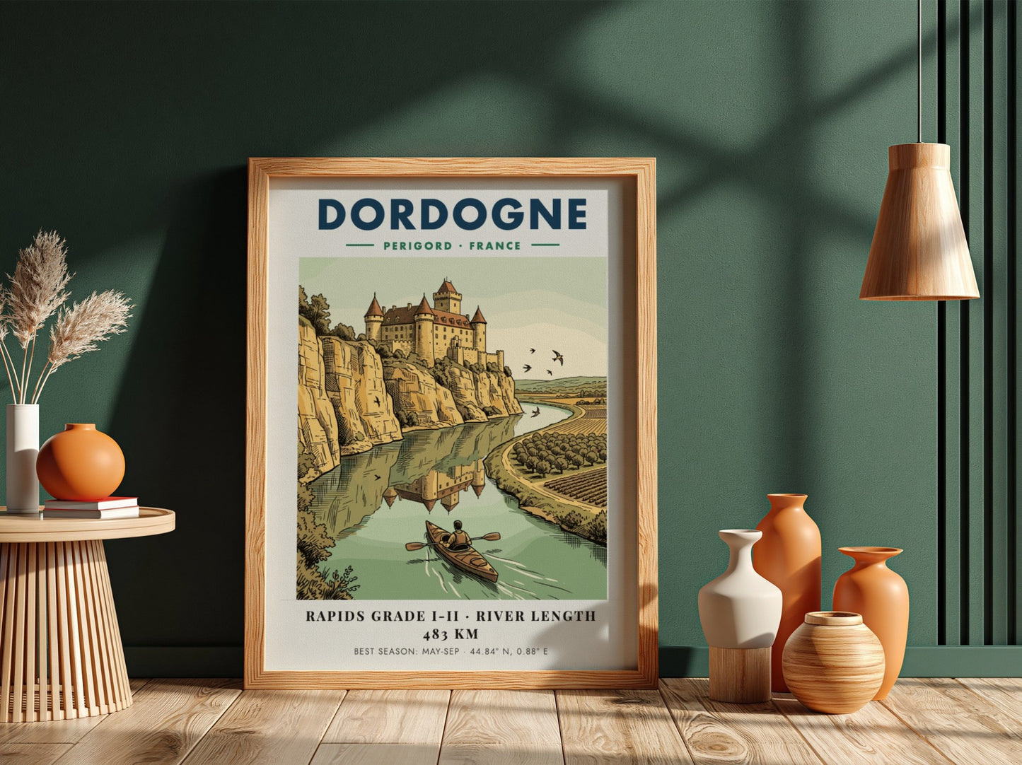 Poster featuring a castle overlooking the Dordogne River with a person kayaking below