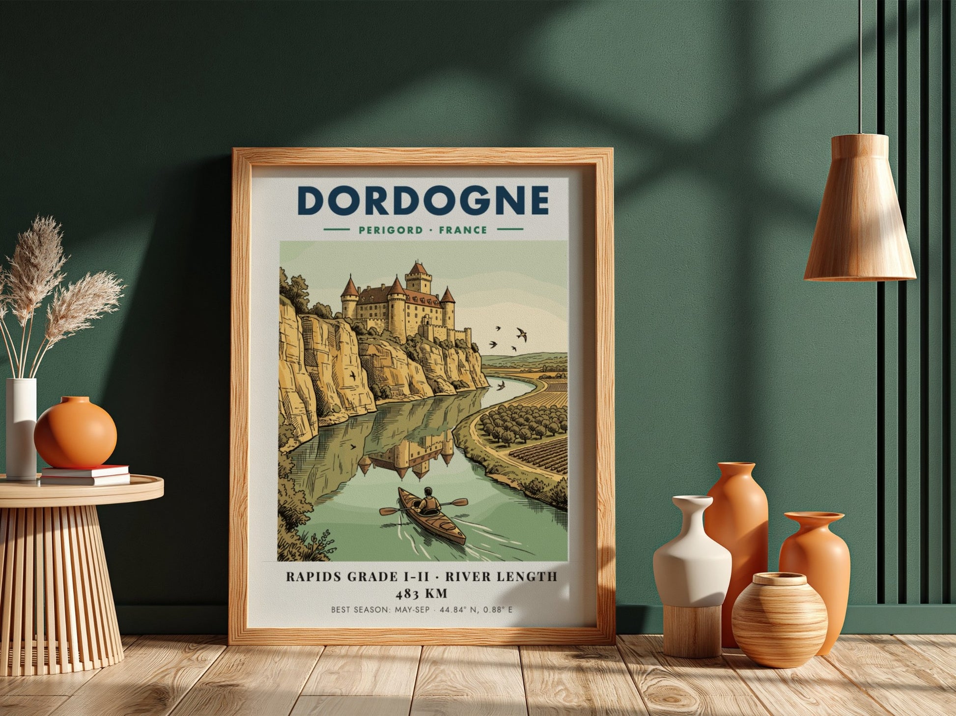 Poster featuring a castle overlooking the Dordogne River with a person kayaking below