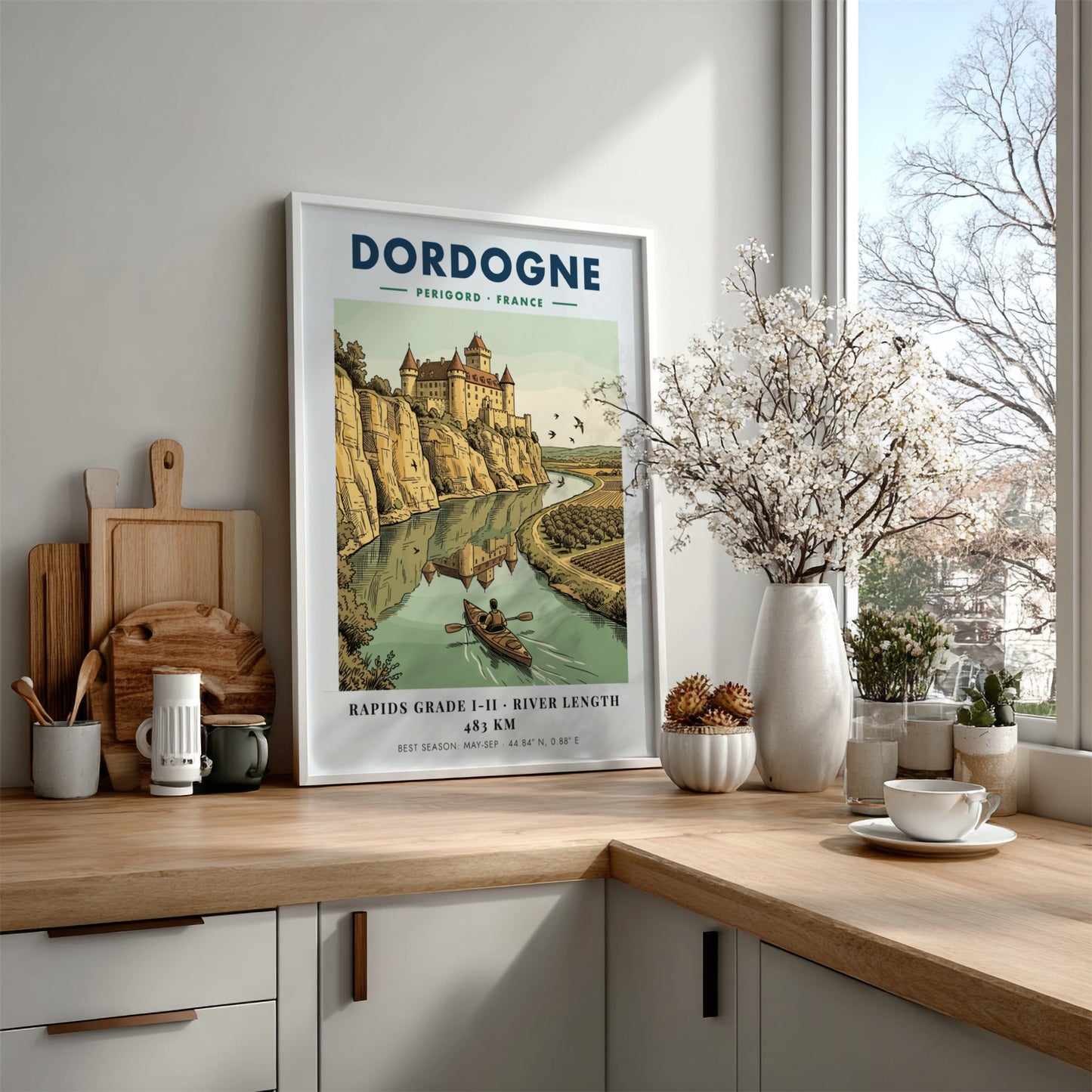 Poster featuring a castle overlooking the Dordogne River with a person kayaking below