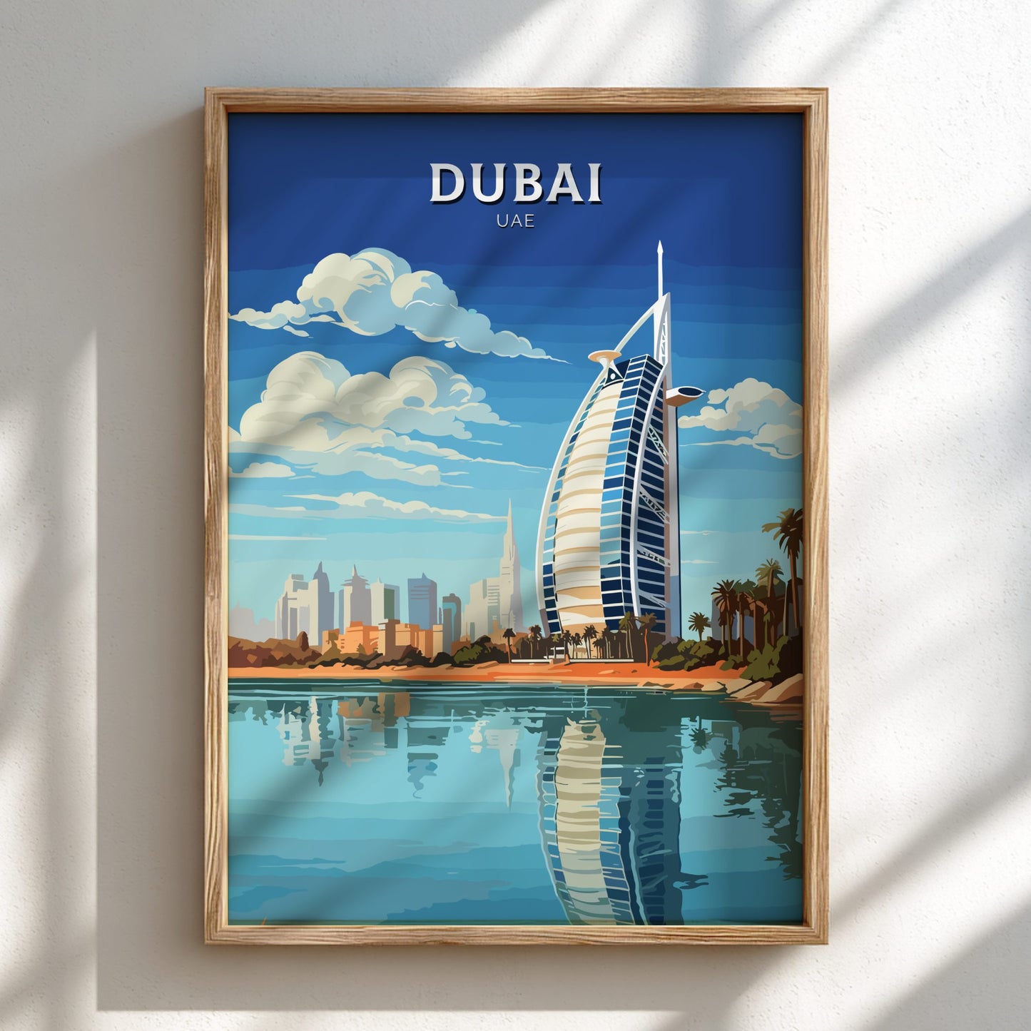 Framed artwork of Dubai with the Burj Al Arab hotel on a blue sky background.