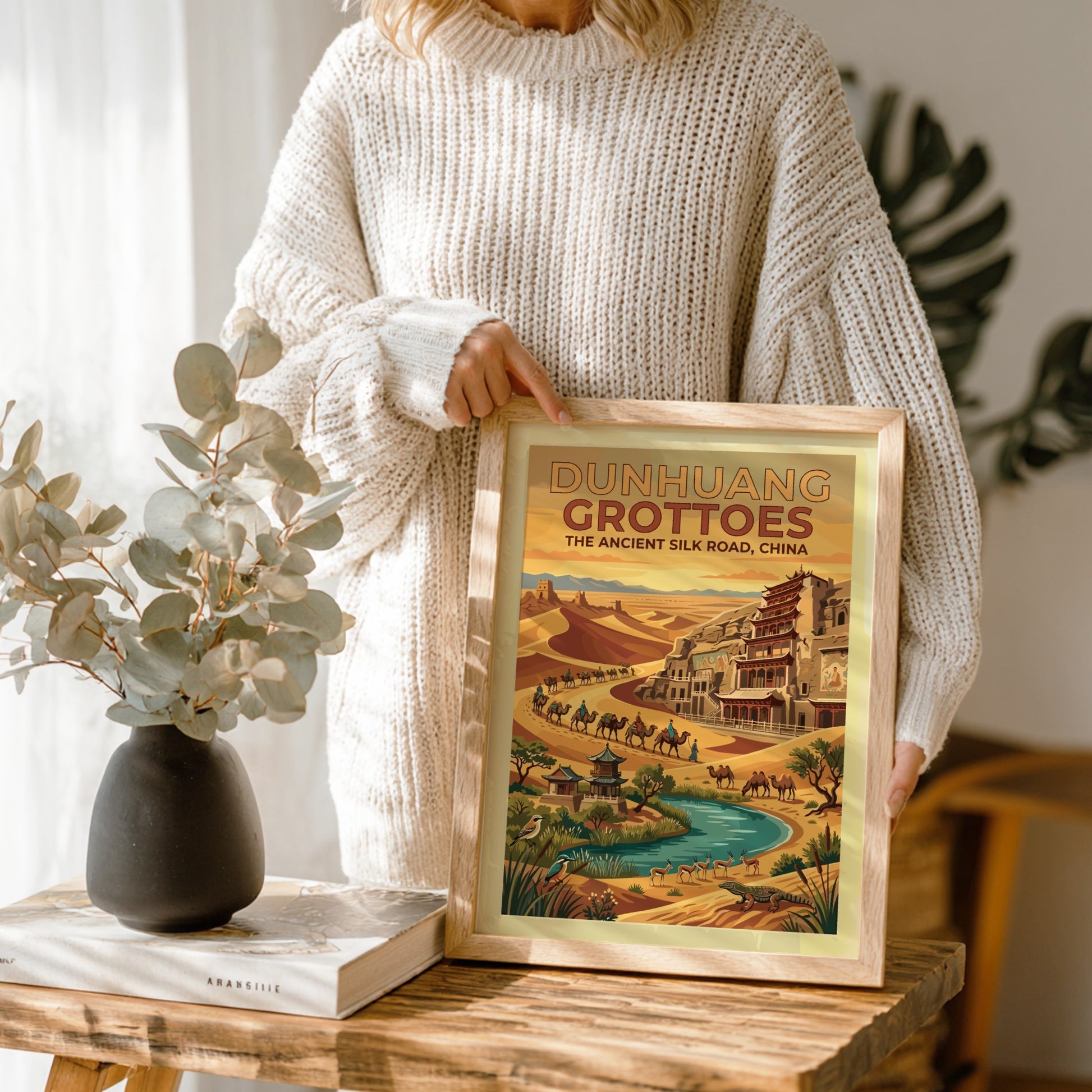 Travel poster featuring Dunhuang Grottoes on the ancient Silk Road with desert dunes camels
