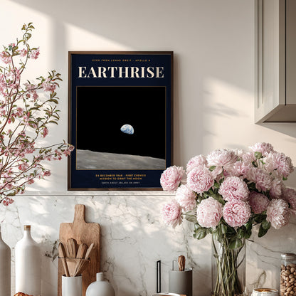 Earthrise poster showing the blue Earth rising above the grey lunar surface in space