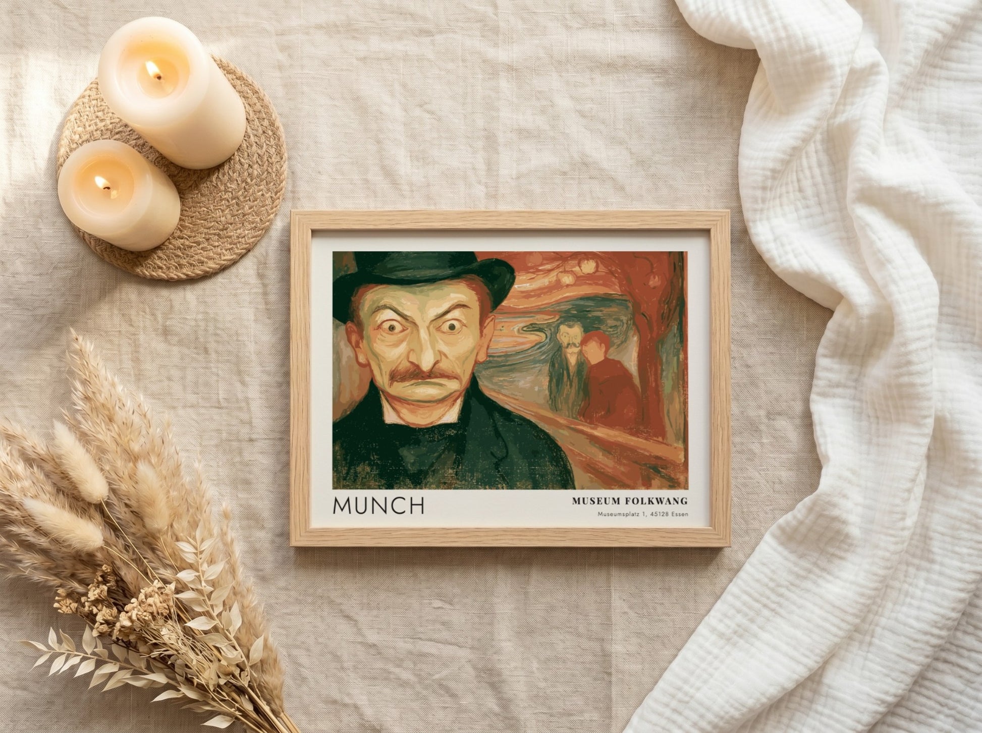 Exhibition poster featuring a wide-eyed man by Munch in a wooden frame display.