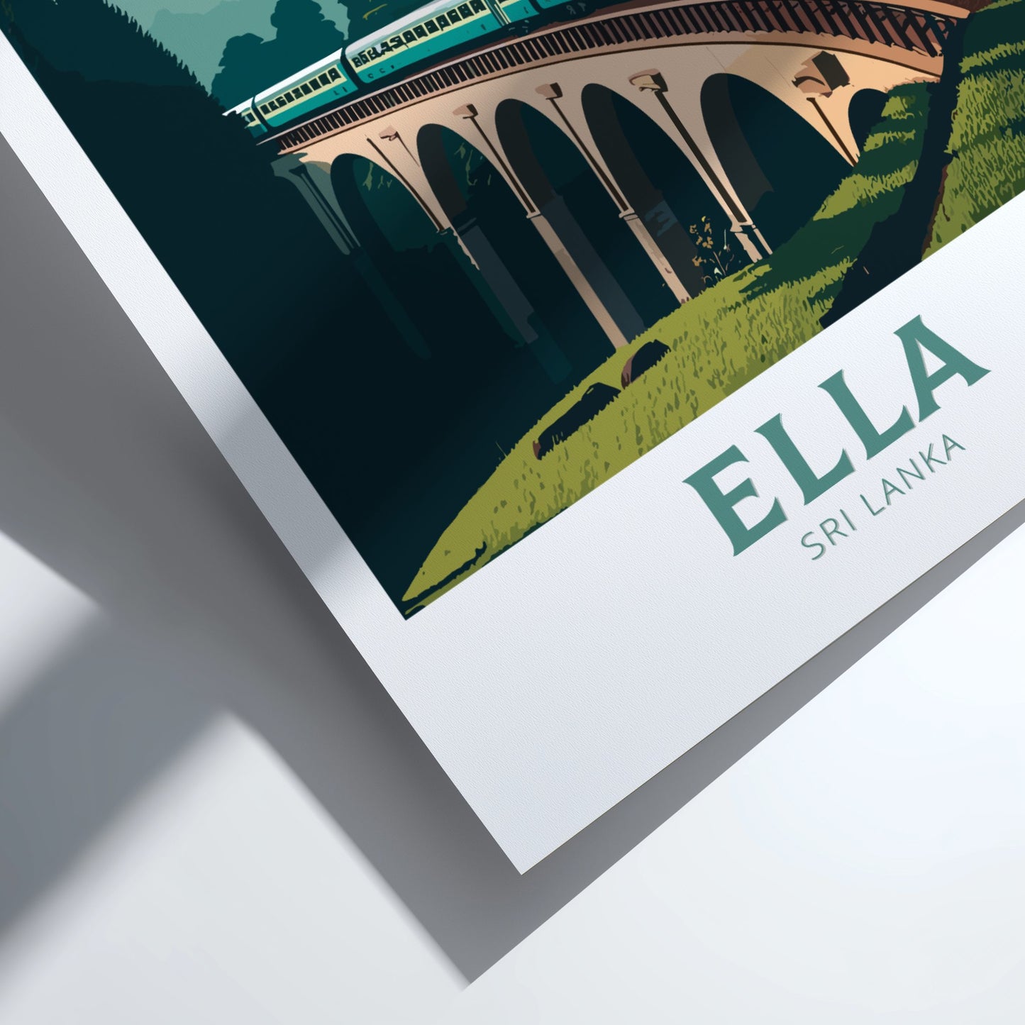 Framed artwork of a bridge with 'Ella, Sri Lanka' text on a white background