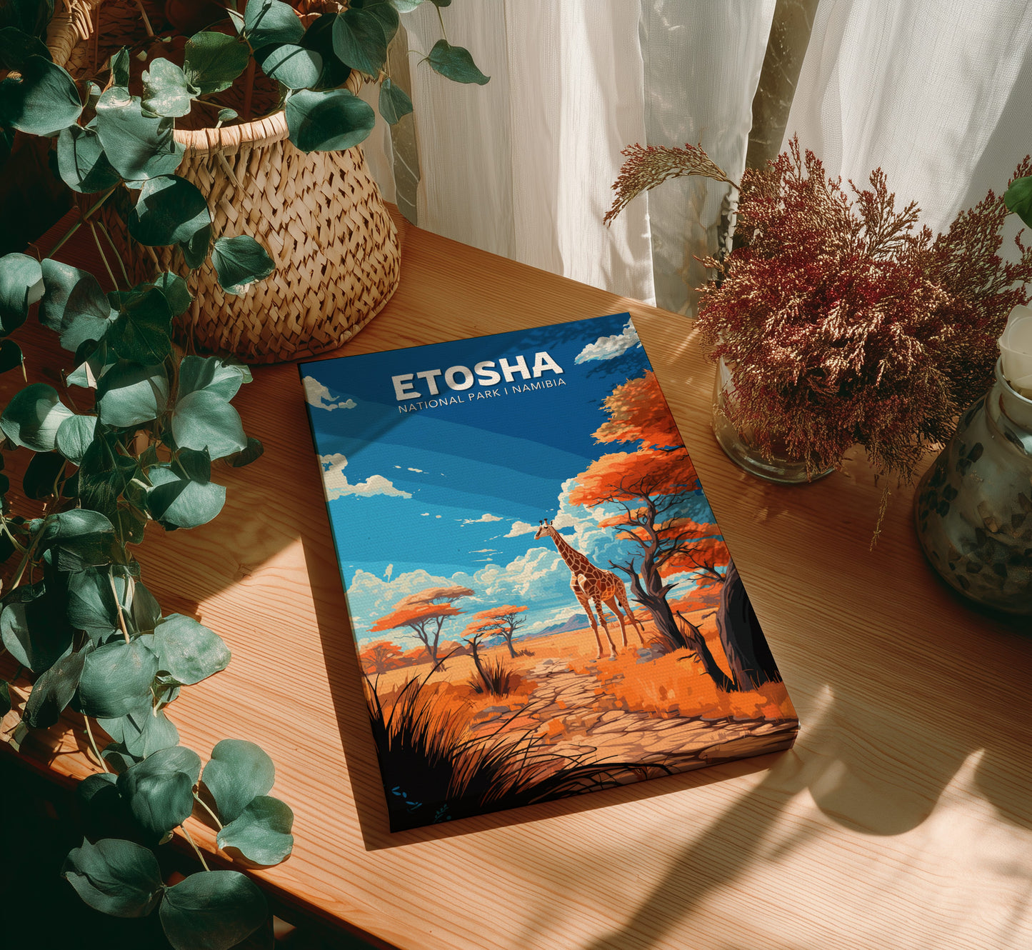 canvas print of 'Etosha' on a wooden surface with plants around