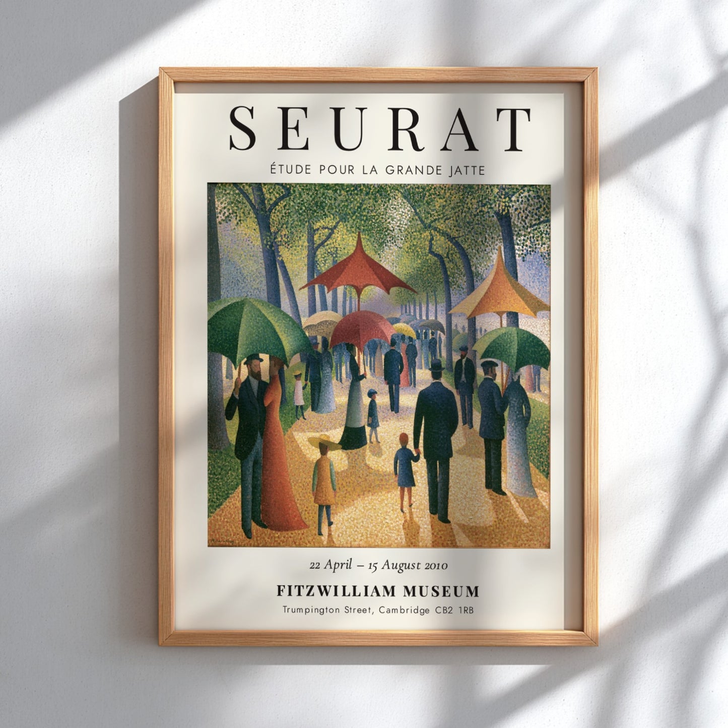 Seurat exhibition poster featuring Étude pour la Grande Jatte with vibrant colors and park scene in