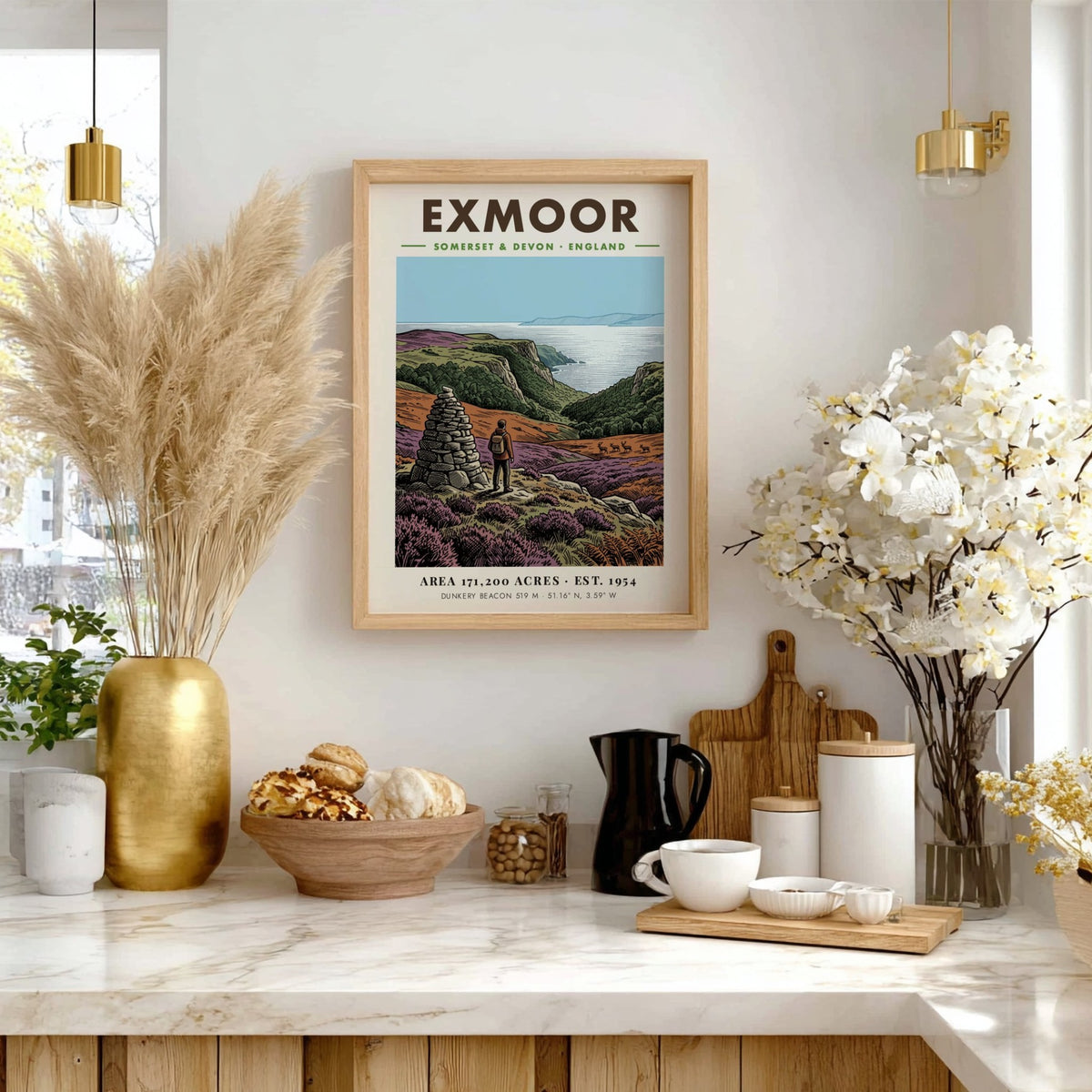 Poster of a hiker by a stone cairn overlooking Exmoor coast in England