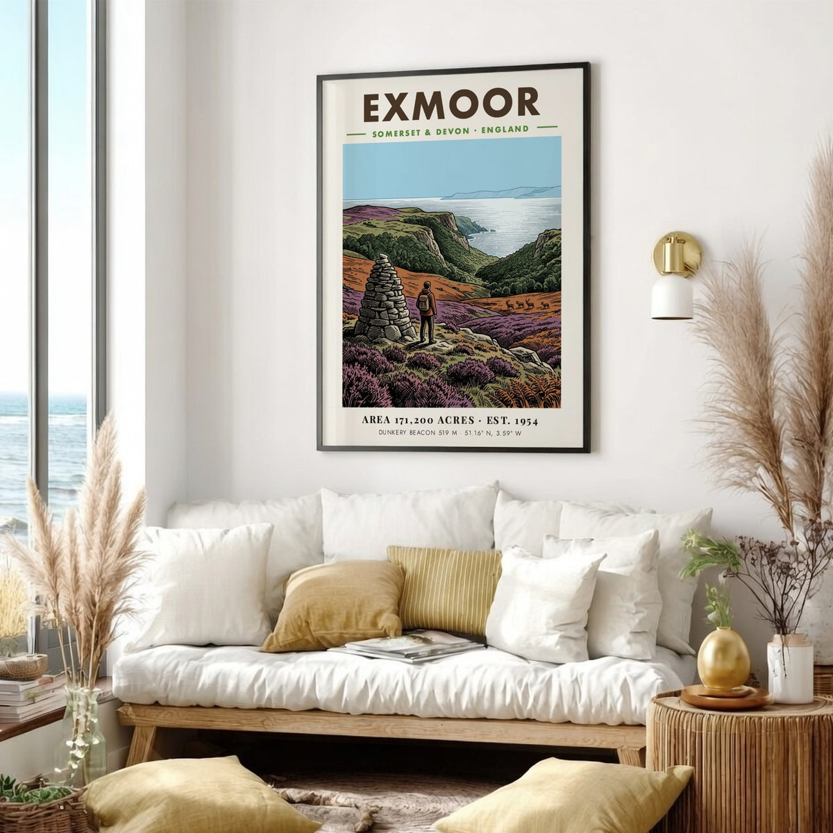 Poster of a hiker by a stone cairn overlooking Exmoor coast in England
