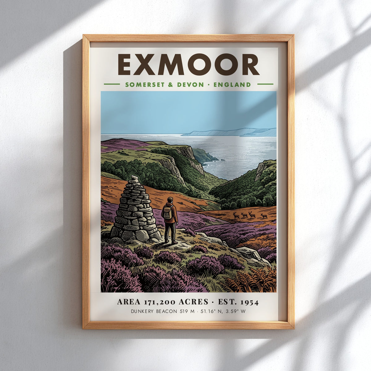 Poster of a hiker by a stone cairn overlooking Exmoor coast in England