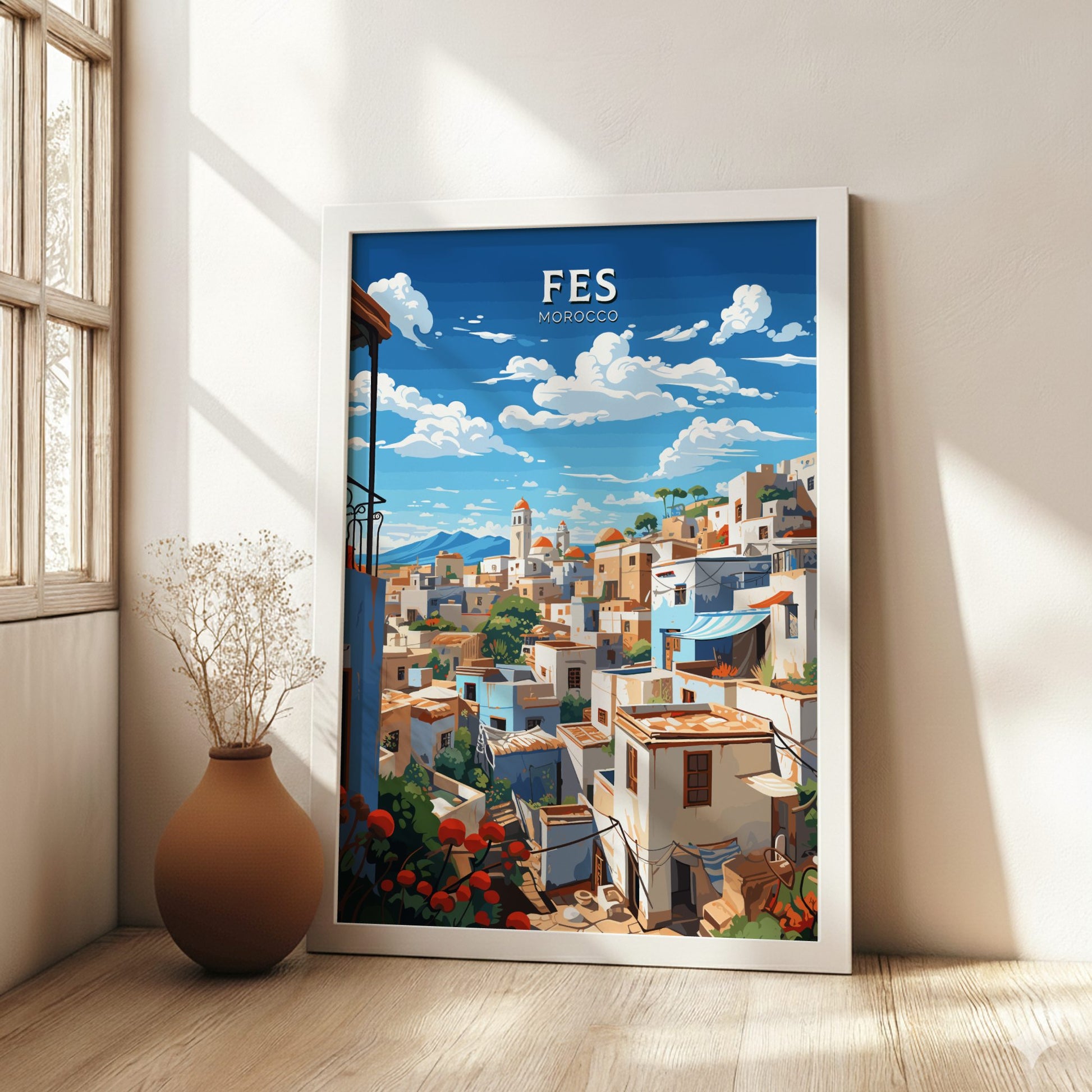 Framed artwork of Fes, Morocco with a cityscape on a wall.