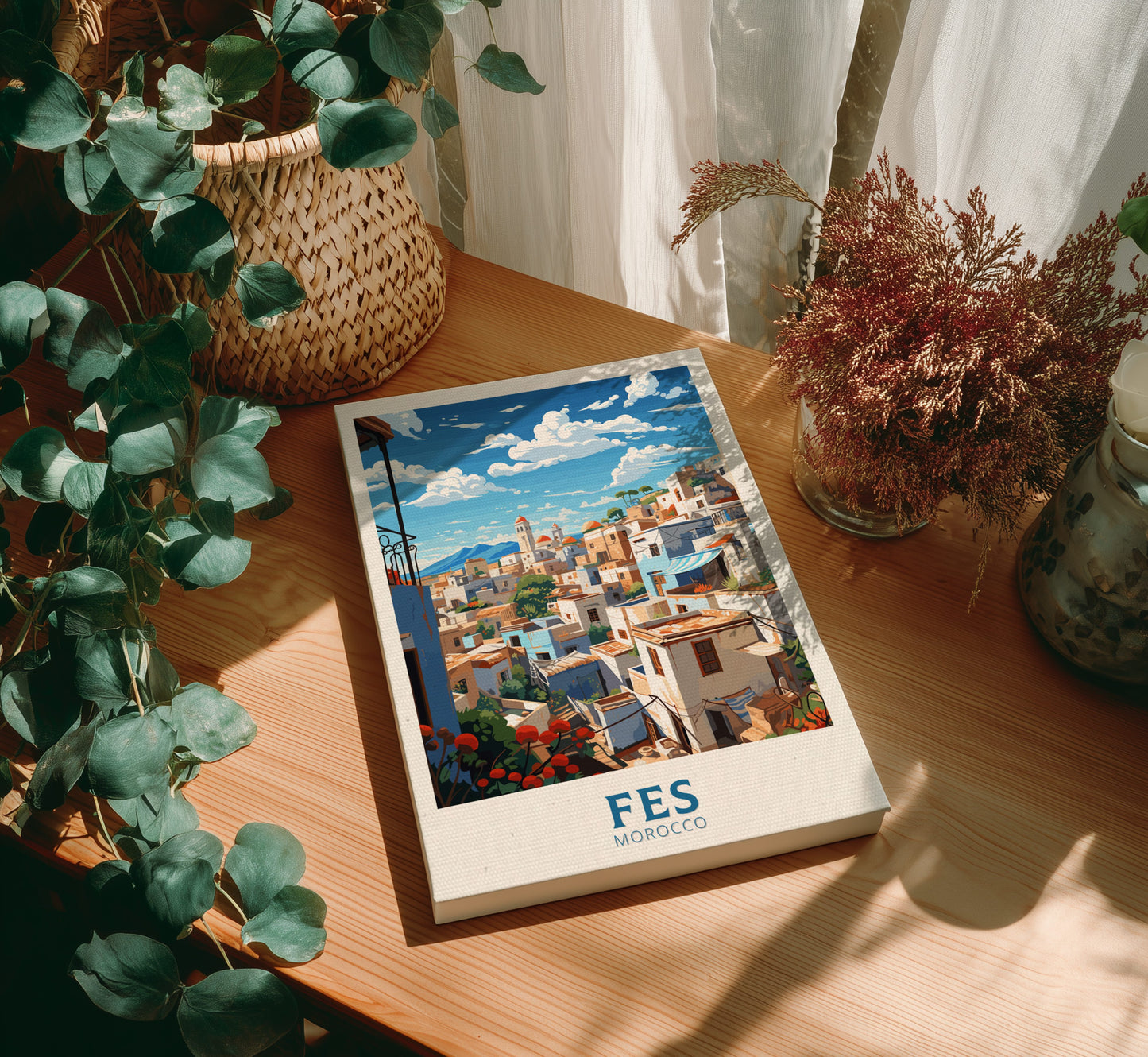 Canvas 'FES Morocco' on a wooden table with plants around