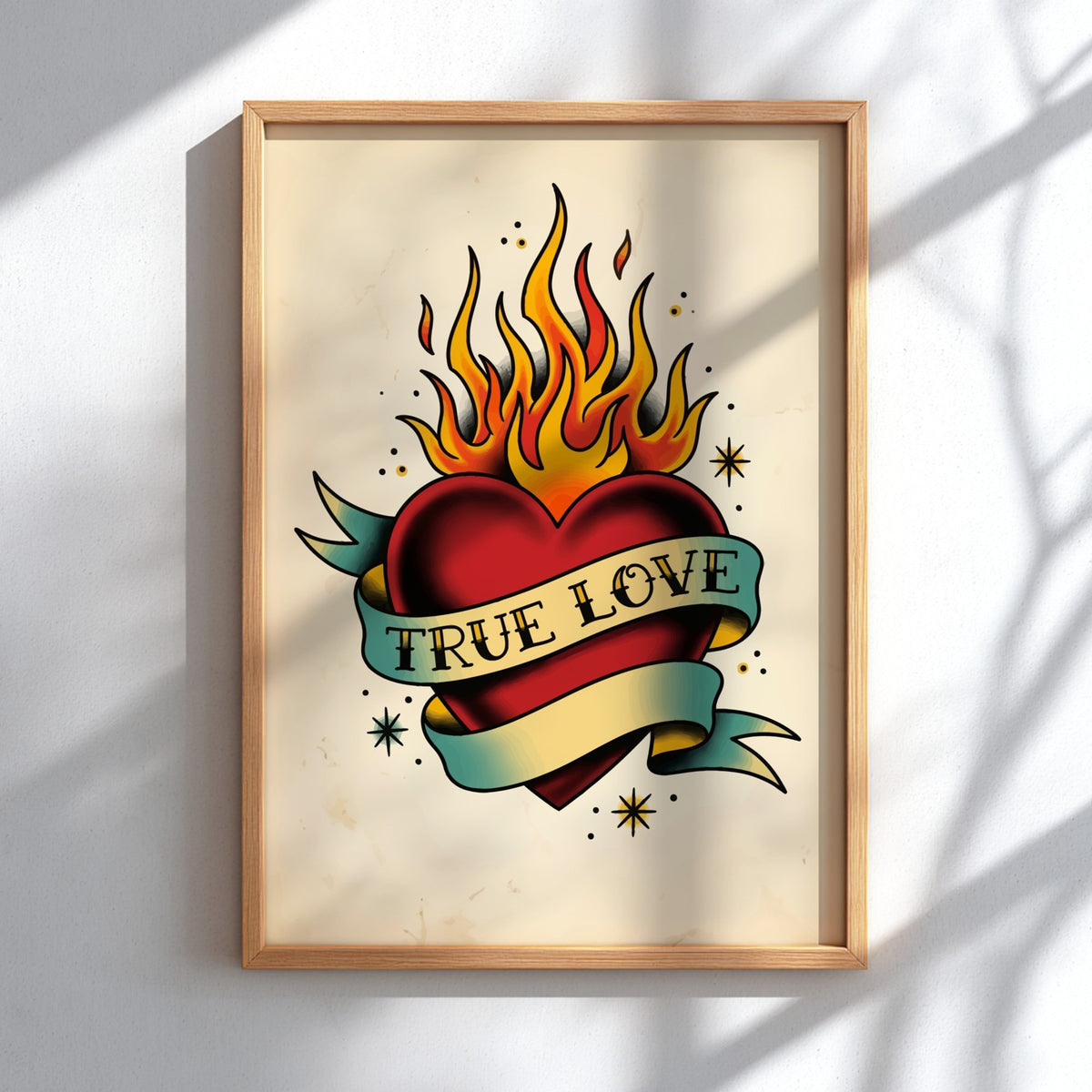 Poster featuring a traditional tattoo style heart with flames and a true love banner