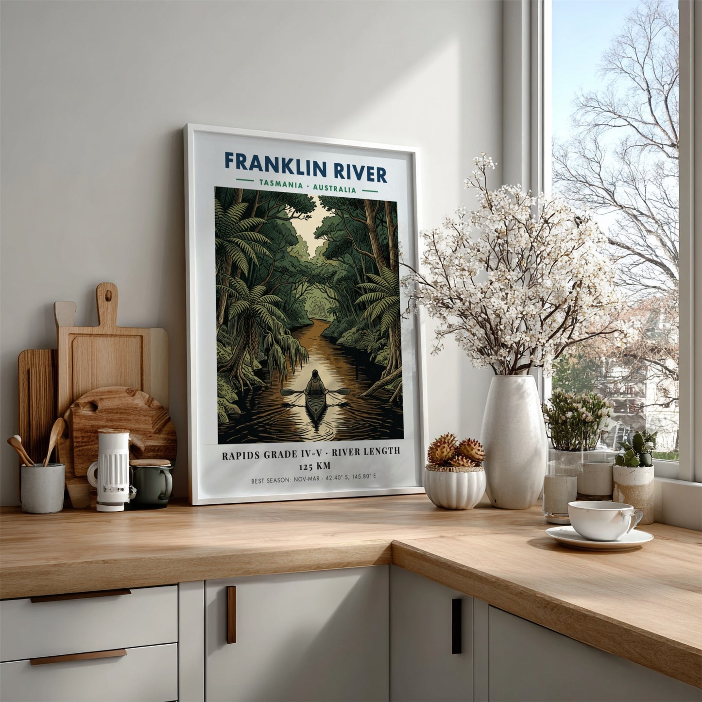 Poster featuring a solo kayaker on the Franklin River in Tasmania amidst lush forests.
