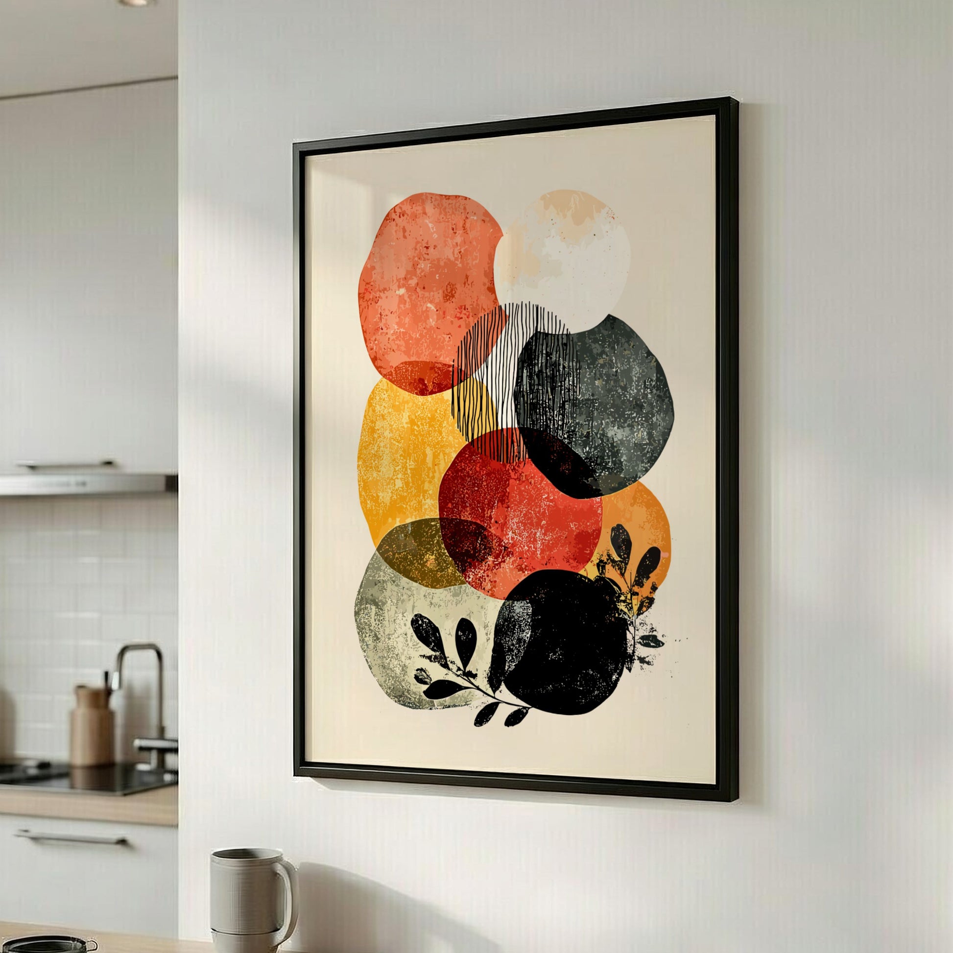 Framed abstract art print with colorful circles on a wall in a kitchen.