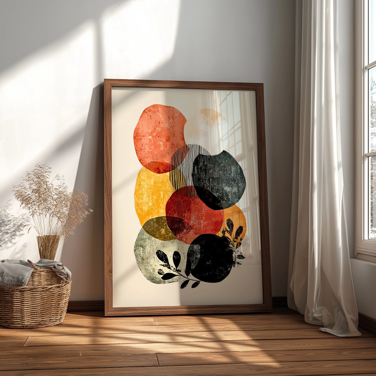 Framed abstract art print on a wall with natural light casting shadows.