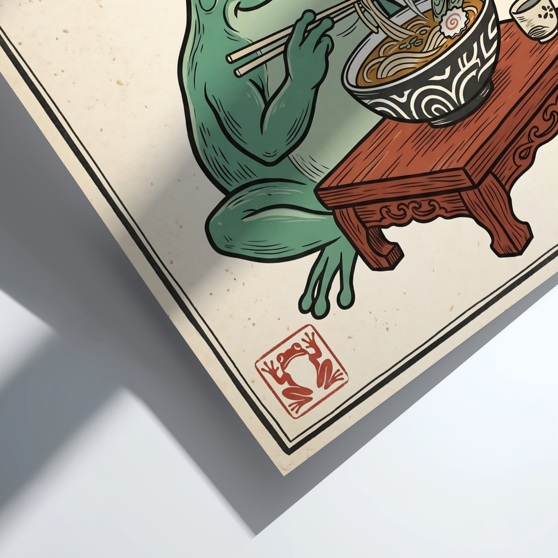 Japanese art style poster featuring a frog eating ramen with steam rising, colorful and whimsical design