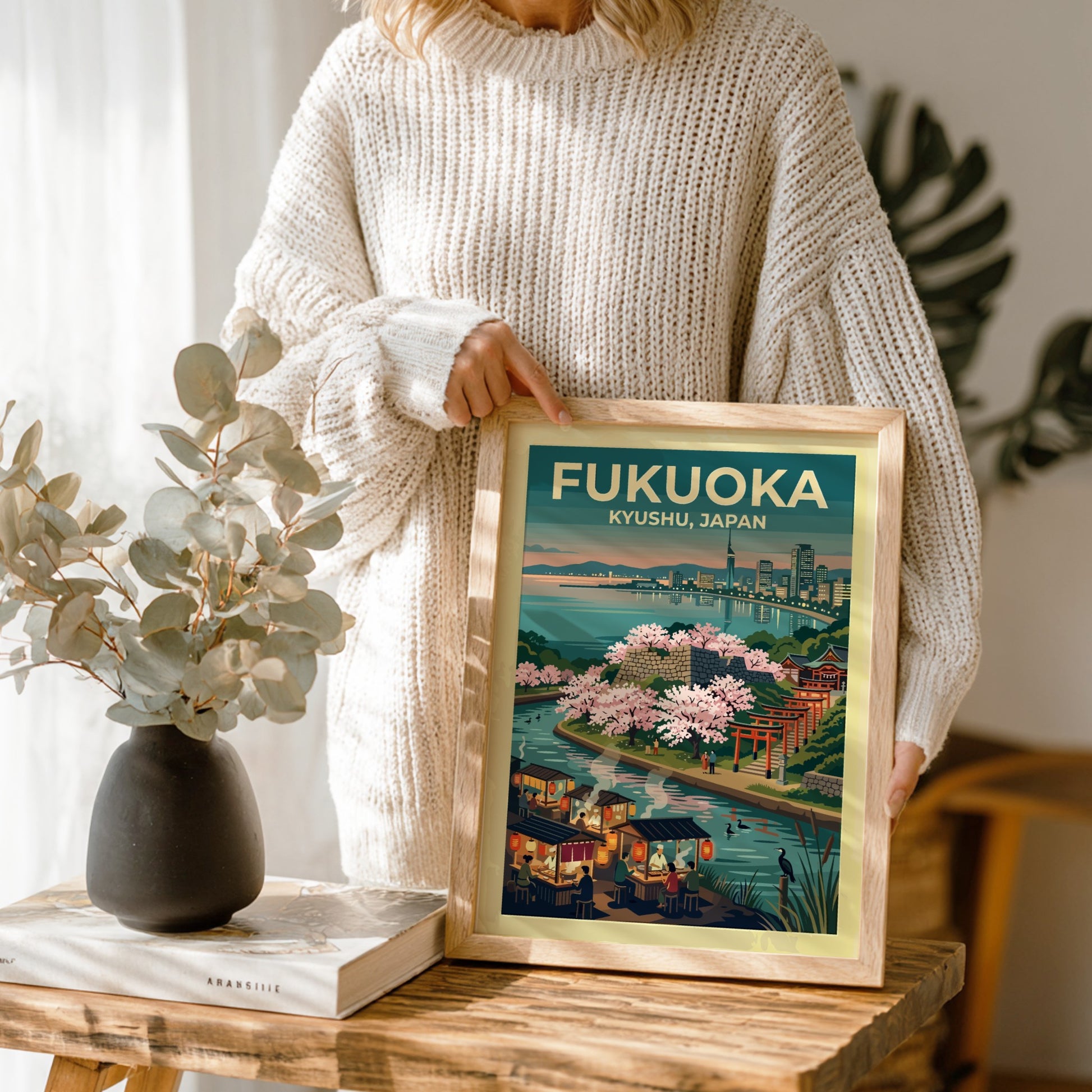 Travel poster of Fukuoka Kyushu Japan featuring a waterfront city, cherry blossoms, and stalls.